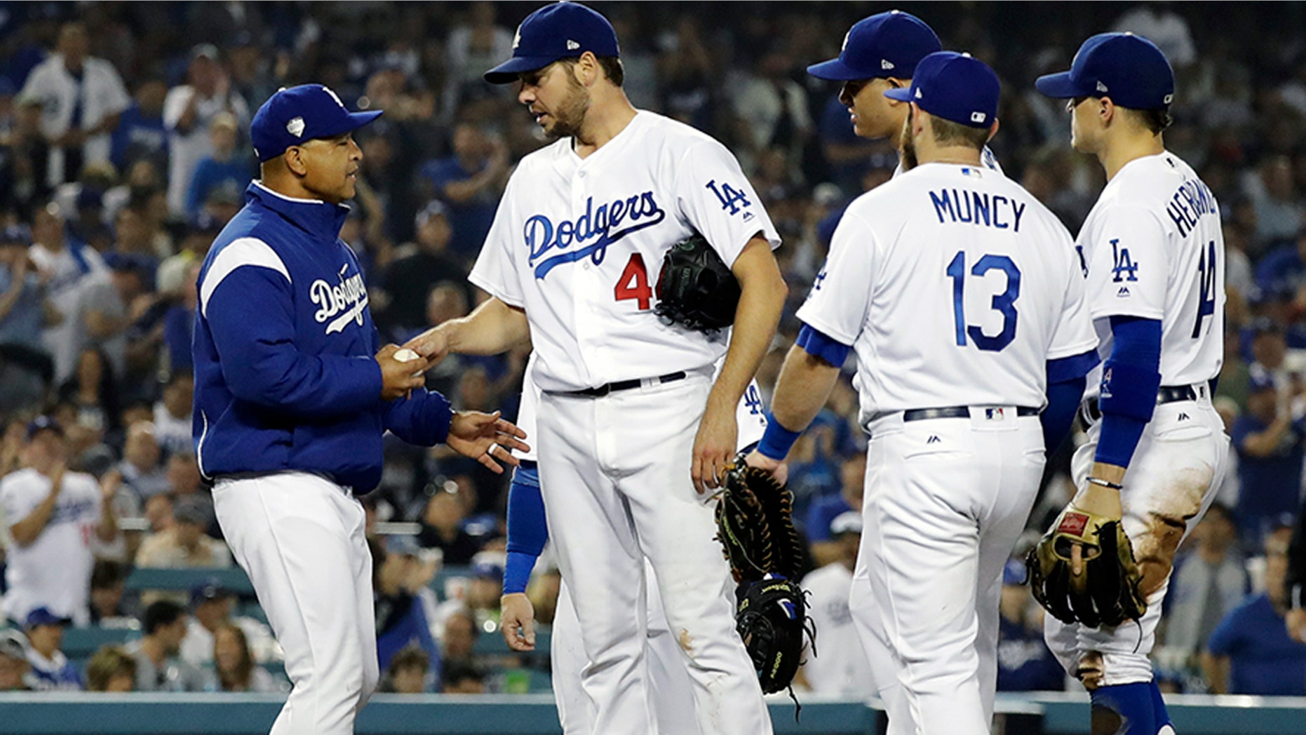 Los Angeles Dodgers pitcher Rich Hill is relieved by Los Angeles Dodgers manager Dave Roberts during the seventh inning in Game 4 of the World Series baseball game on Saturday, Oct. 27, 2018, in Los Angeles. (AP Photo/David J. Phillip)