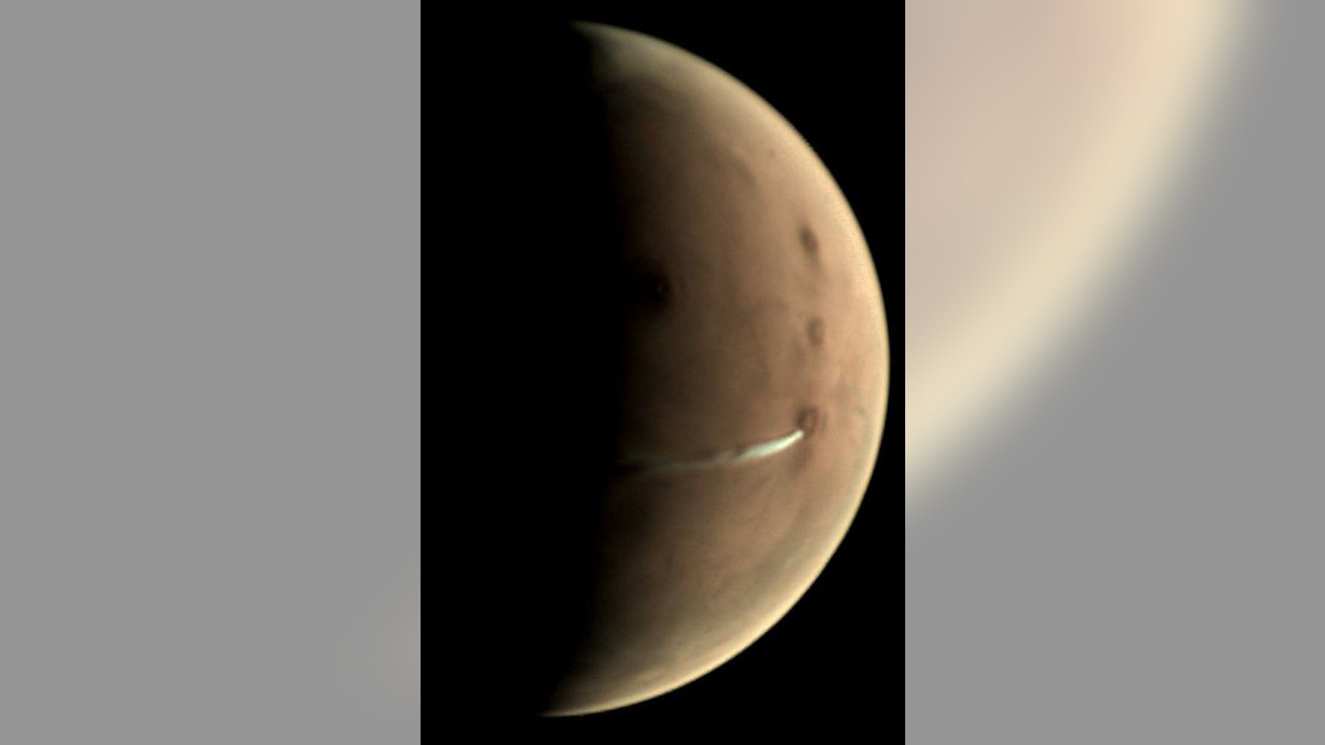 Since 13 September 2018, the Visual Monitoring Camera (VMC) on board ESA’s Mars Express has been observing the evolution of a curious cloud formation that appears regularly in the vicinity of the 20 km-high Arsia Mons volcano, close to the planet’s equator. (Credit: ESA/GCP/UPV/EHU Bilbao, CC BY-SA 3.0 IGO)