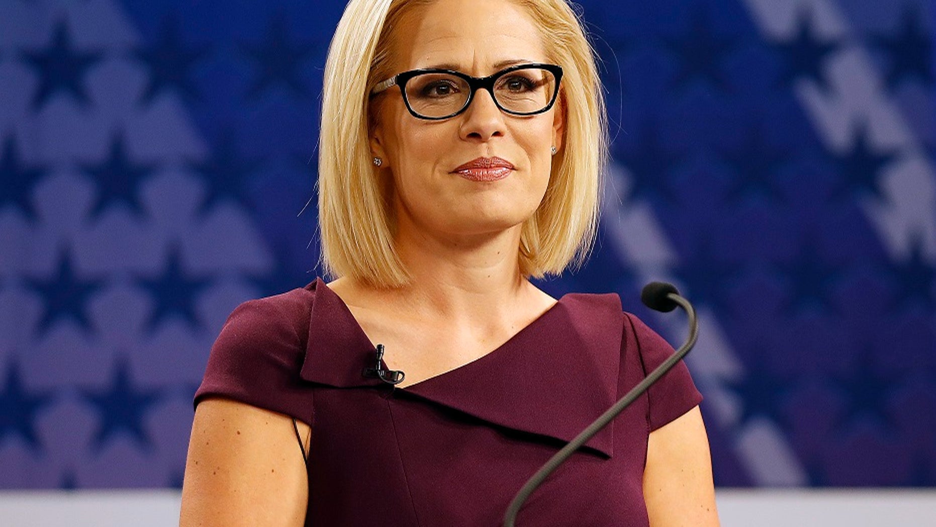 U.S. Rep. Kyrsten Sinema, D-Ariz., goes over the rules in a television studio prior to a televised debate with U.S. Rep. Martha McSally, R-Ariz.