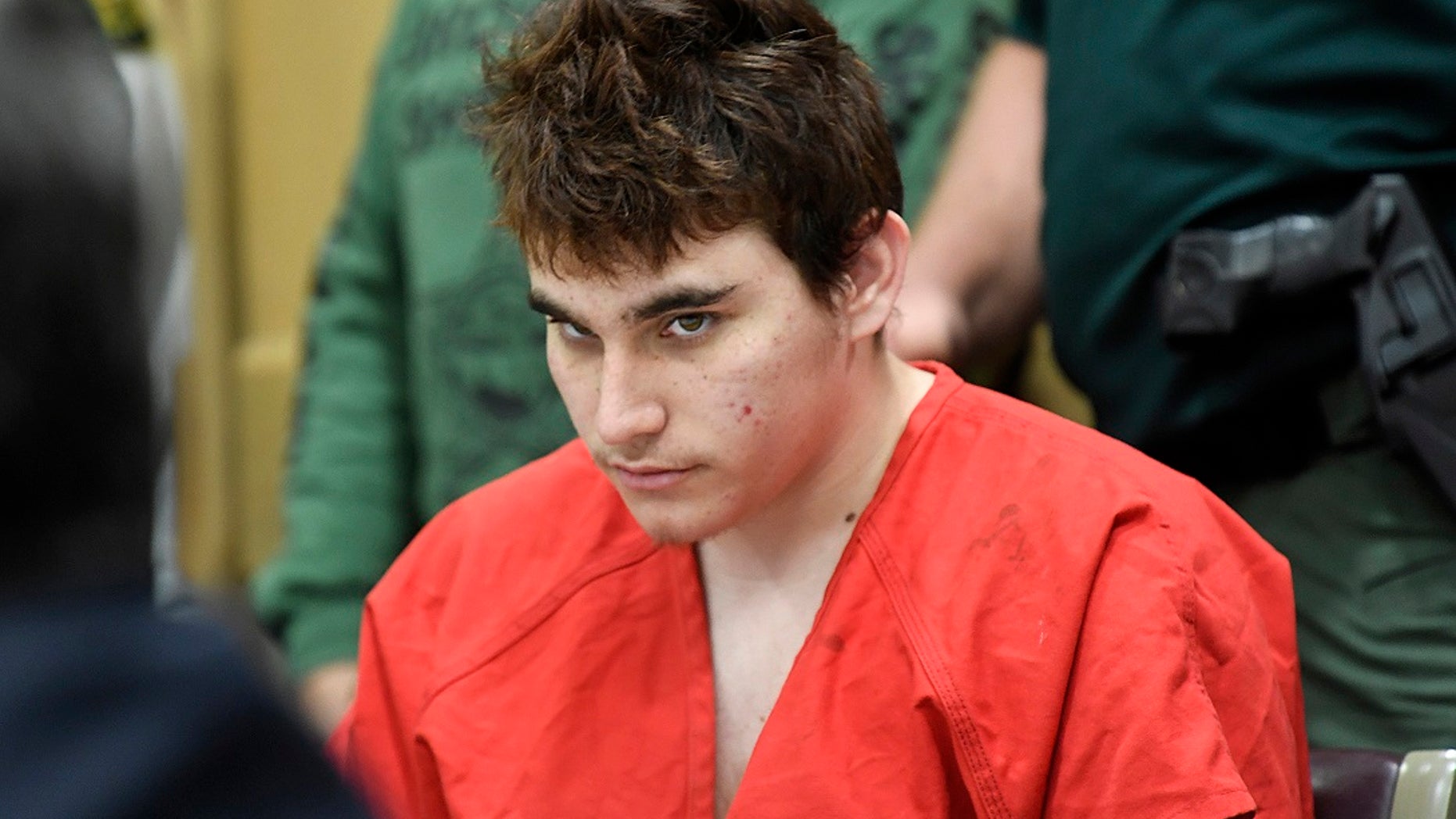 FILE - Florida school shooting suspect Nikolas Cruz looks up while in court for a hearing in Fort Lauderdale, Fla.