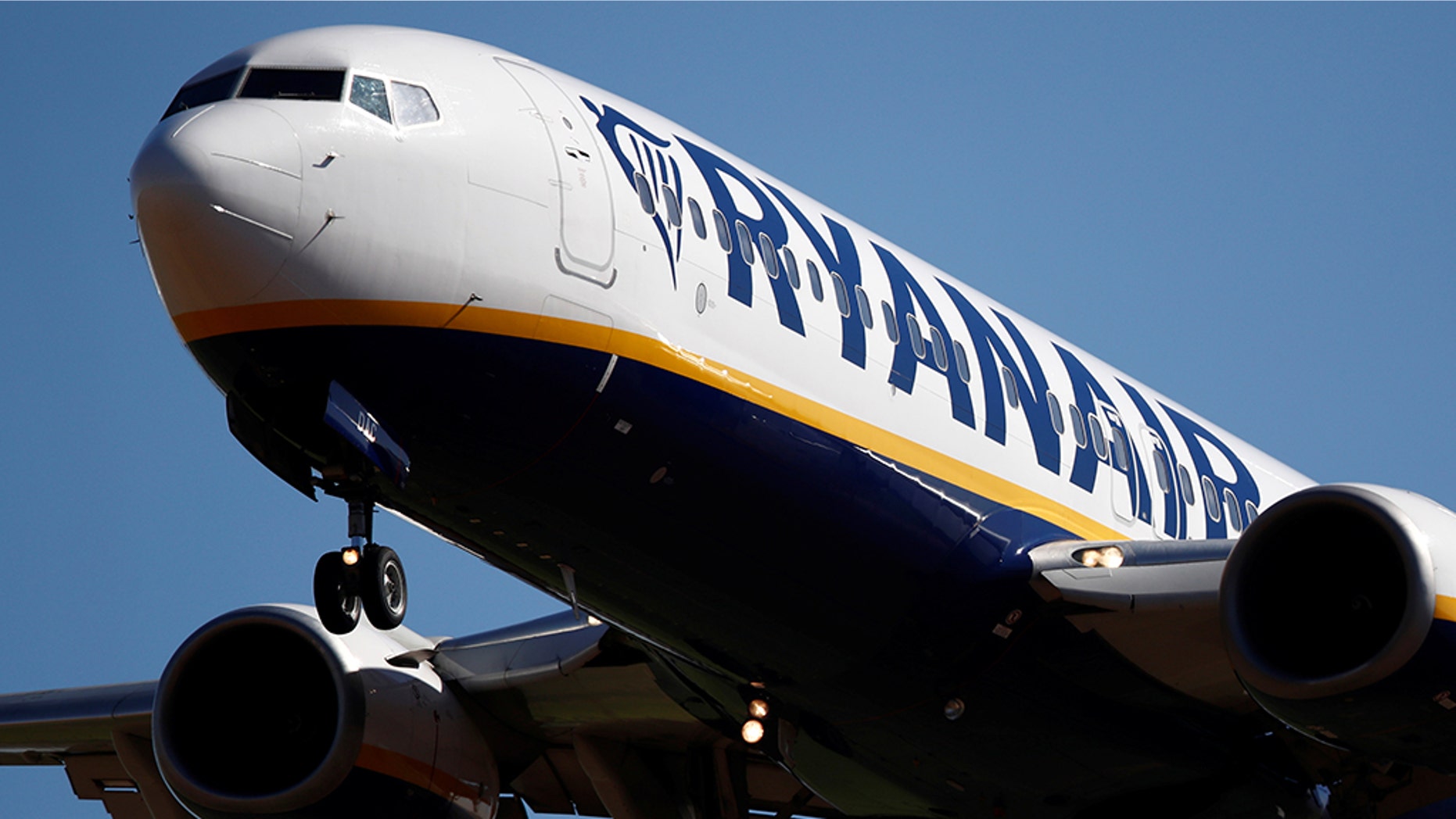 Ryanair dismissed six staff members after an alleged "staged" photo went viral showing them sleeping on the floor of an airport in Spain.