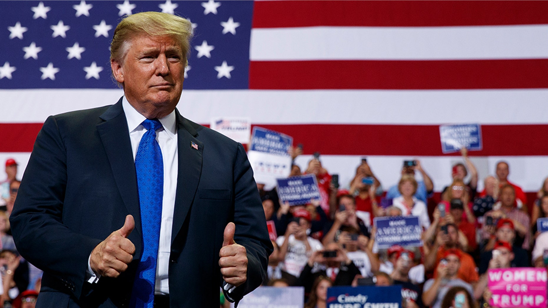 President Trump gives two thumbs up to supporters at a rally earlier this year.