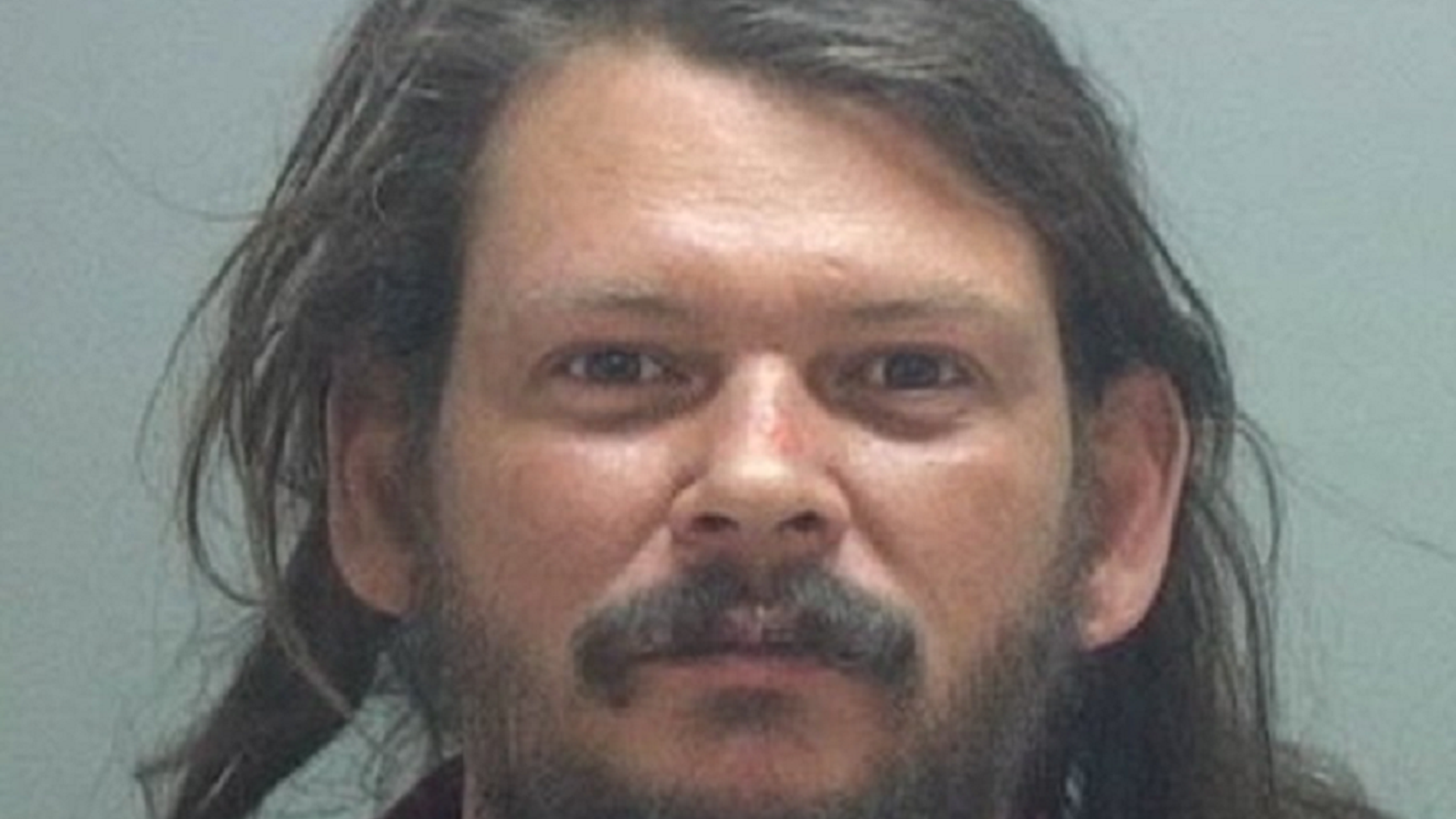 Benjamin Scott Overall was shot after "aggressively" approaching a Starbucks patron, according to criminal charges.