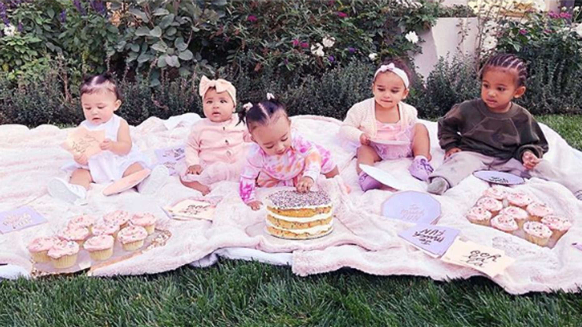 Khloe Kardashian hosts her nieces and nephews for a "cousin cupcake party" to celebrate daughter True Thompson's 6-month birthday.