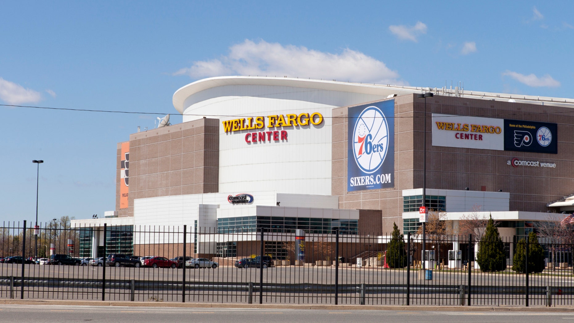 A basketball fan claims she was barred from entering because of her outift.