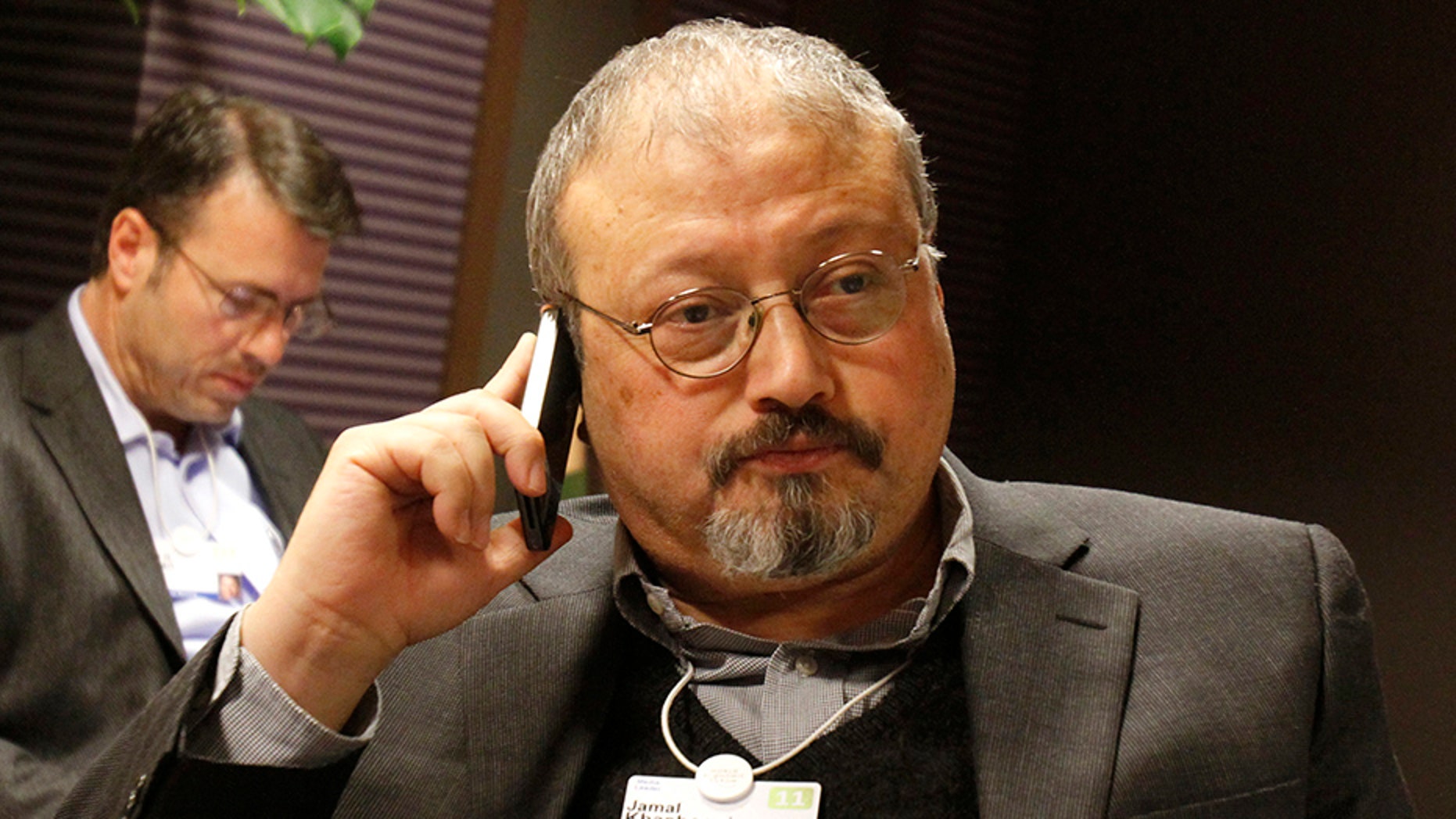 Saudi Arabian journalist Jamal Khashoggi speaks on his cell phone at the World Economic Forum in Davos, Switzerland, in 2011.