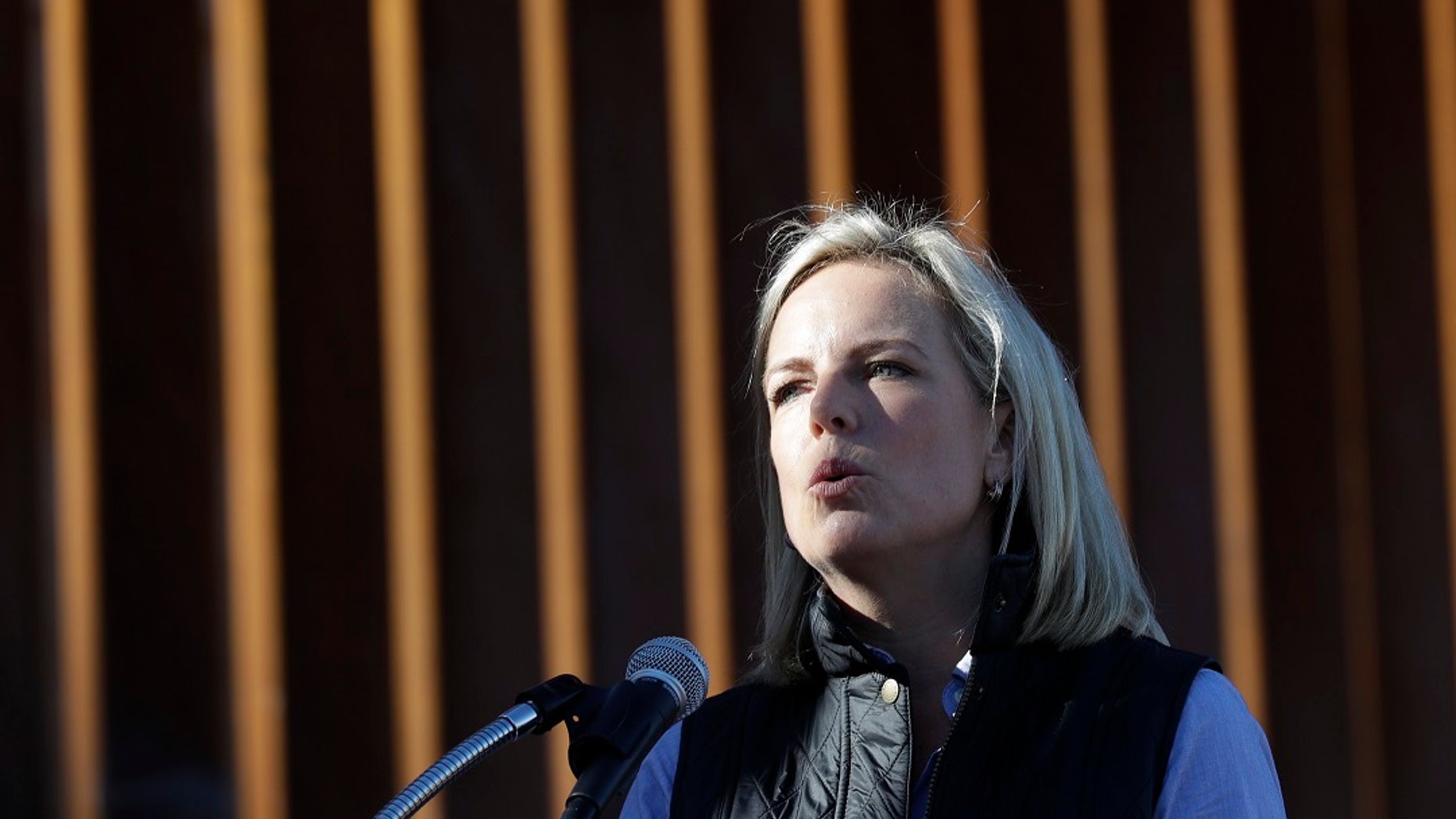 U.S. Department of Homeland Security Secretary Kirstjen Nielsen speaks in front of a newly fortified border wall structure on Friday.