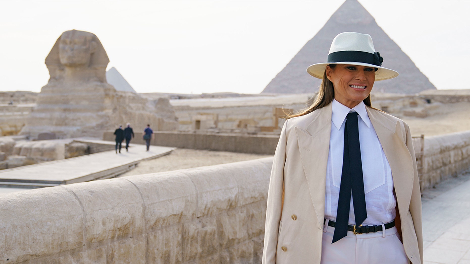 First lady Melania Trump visits the ancient statue of Sphinx, with the body of a lion and a human head, at the historic site of Giza Pyramids in Giza, near Cairo, Egypt, Saturday, Oct. 6