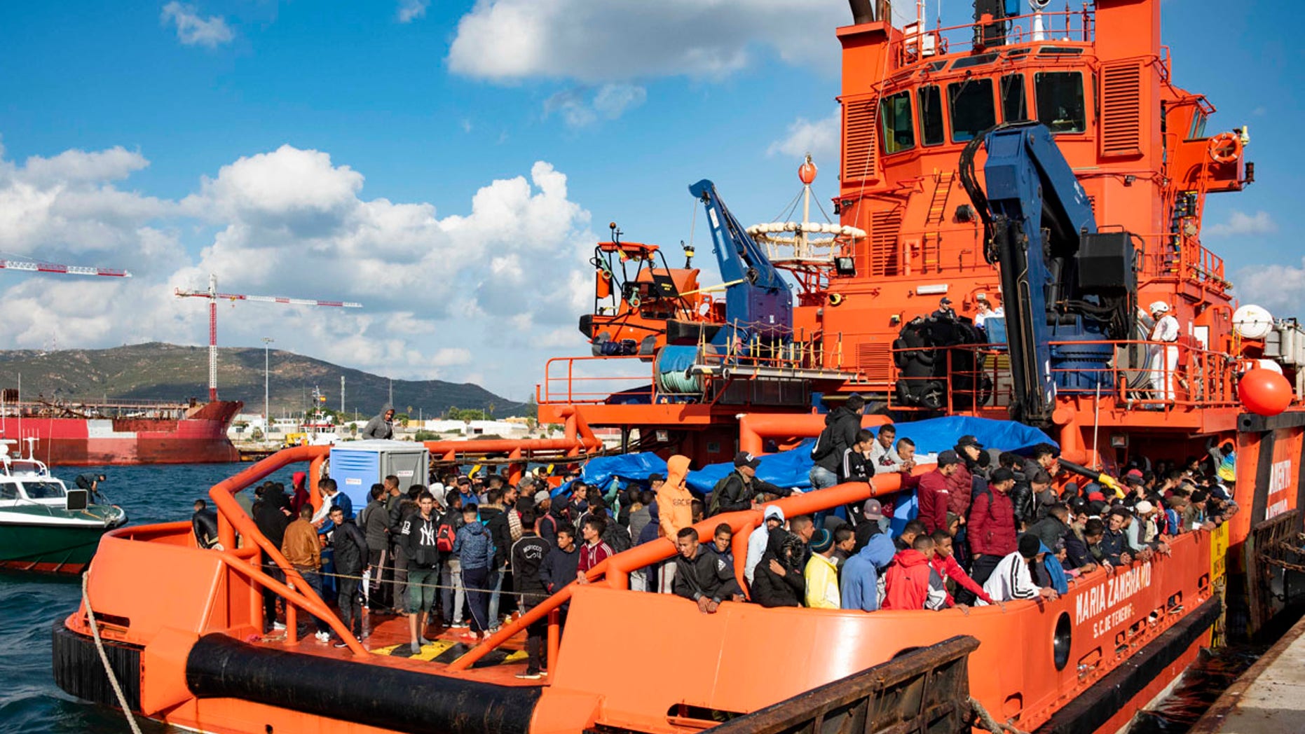 In this photo taken on Saturday, Oct. 27, 2018, migrants arrive at the port of San Roque, southern Spain, after being rescued by Spain's Maritime Rescue Service in the Strait of Gibraltar.