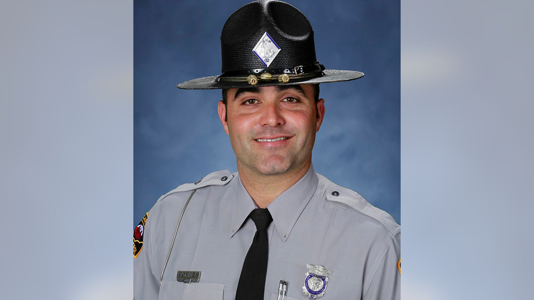 Private Kevin Conner, 38, was shot dead early Wednesday during a roadside check.
