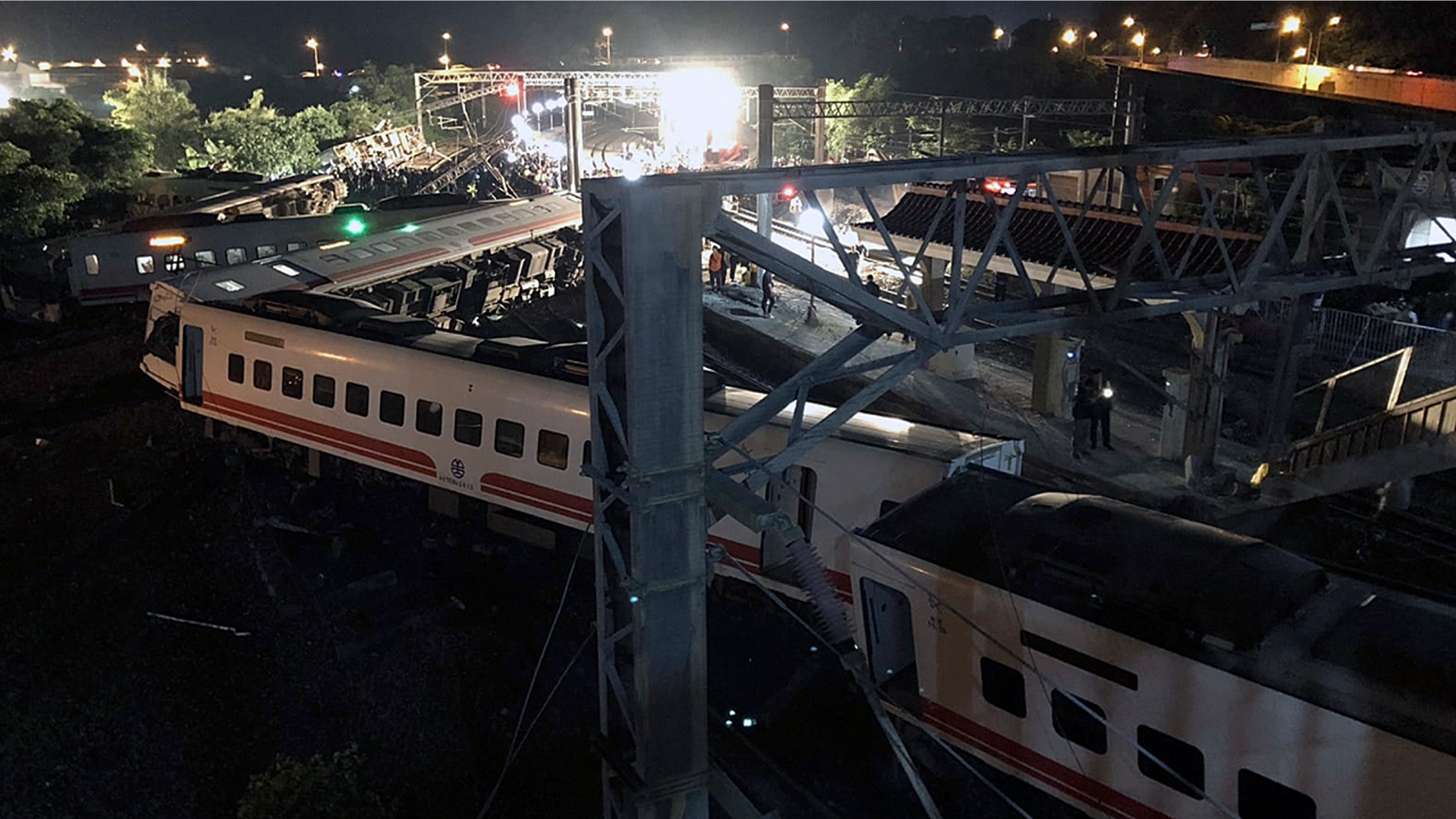 This photo released by Military News Agency shows a general view at the site of a train derailment in Lian in northern Taiwan on Sunday, Oct. 21 2018. The Puyuma express train was carrying more than 300 passengers toward Taitung, a city on Taiwan's southeast coast, when it went off the tracks on Sunday afternoon.