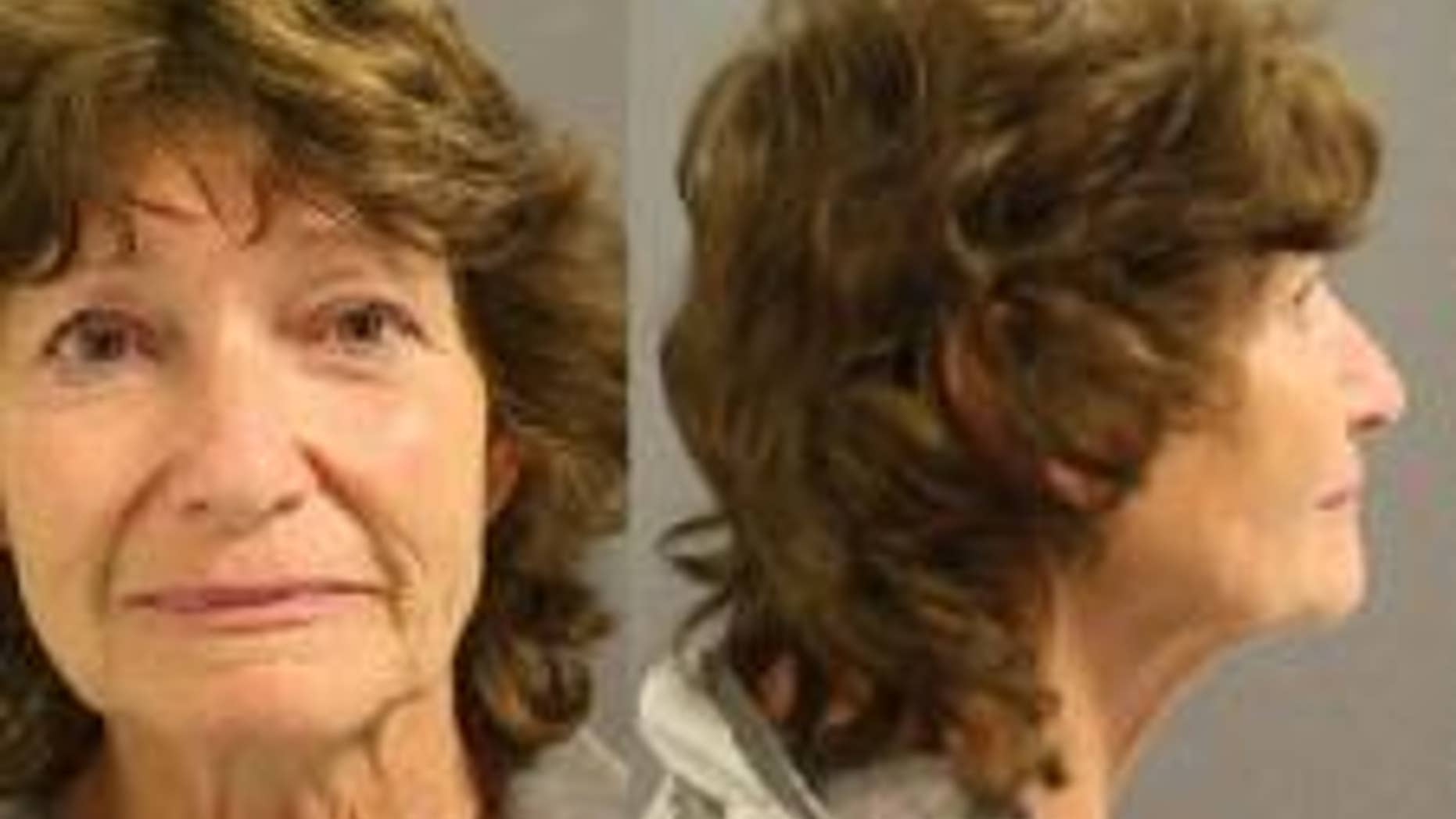 Linda Dwire, 64, was arrested on a harassment charge on Monday. She was captured on video in a verbal confrontation with another shopper defending two Spanish-speaking women.