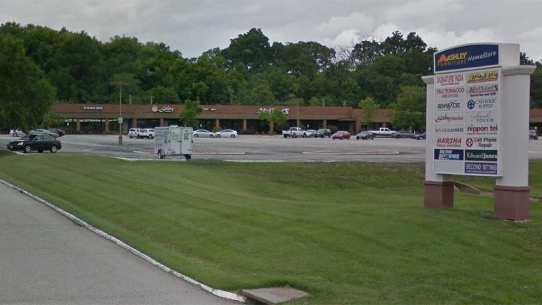 Police in suburban St. Louis are searching for a gunman who went into a religious supply store, sexually assaulted at least one woman and shot a woman in the head.