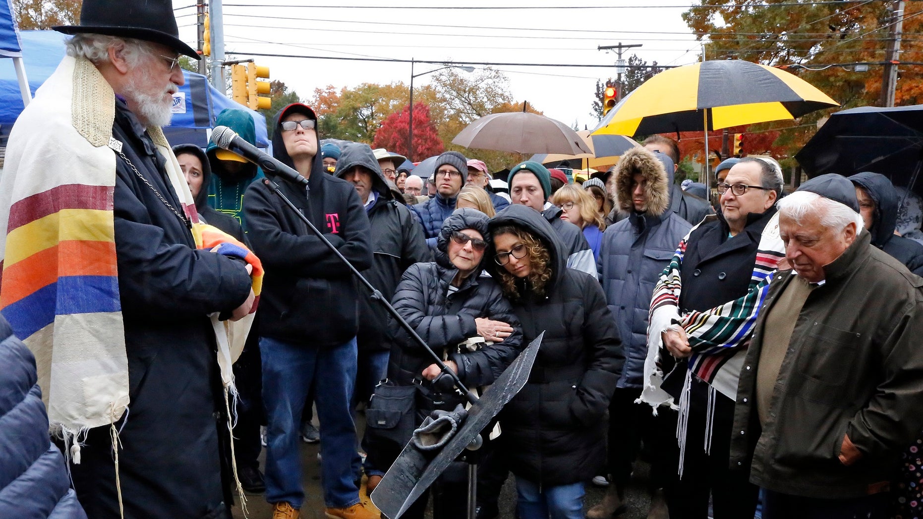 A week after the deadly Pittsburgh synagogue shooting that left 11 people dead, dozens of people reportedly came together for what a former rabbi described as a healing service outside the site of the bloodiest anti-Semitic attack in U.S. history. (AP Photo/Gene J. Puskar)
