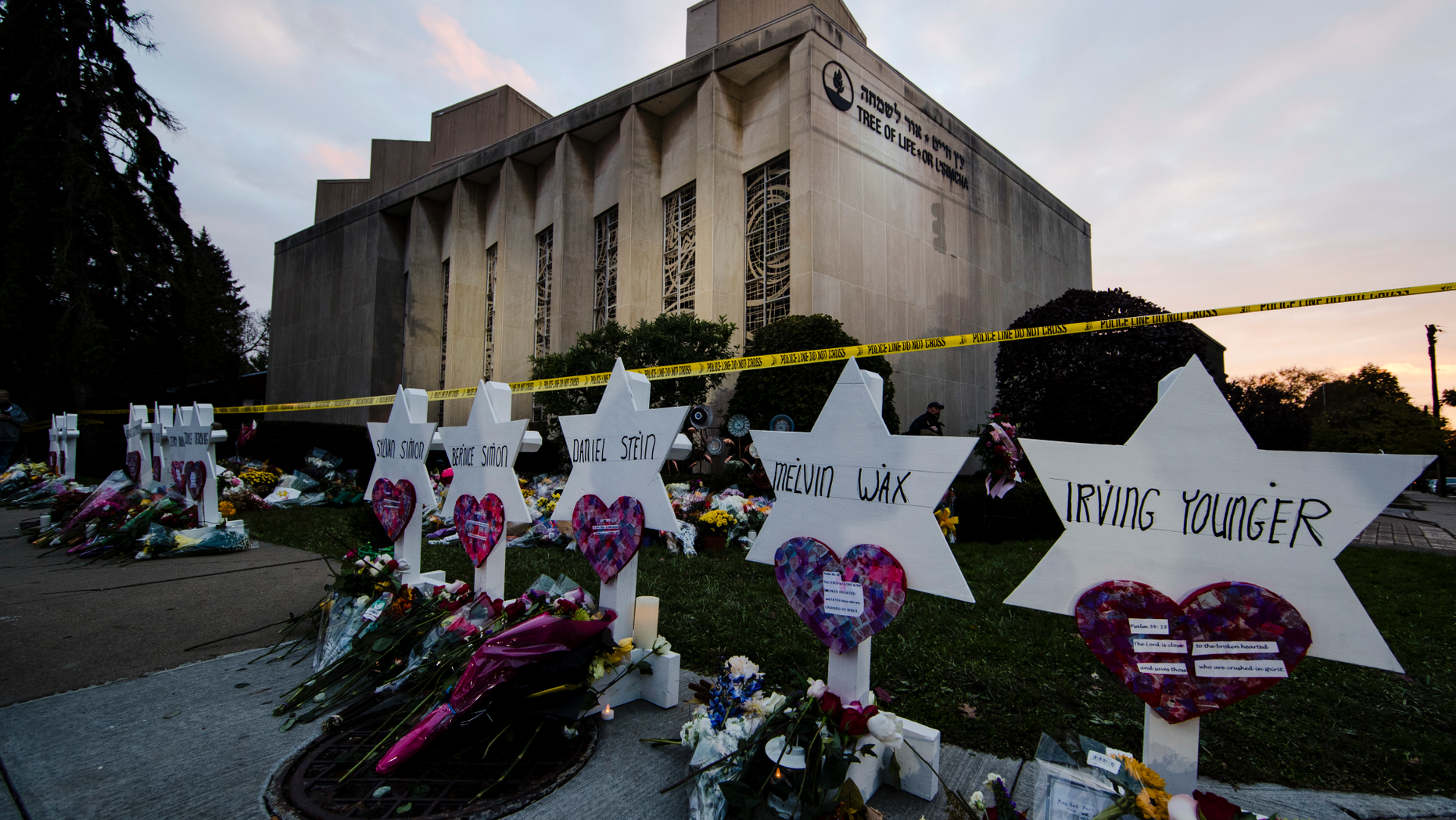 FILE - In this Oct. 29, 2018, file photo, a makeshift memorial stands outside the Tree of Life synagogue in the aftermath of a deadly shooting at the in Pittsburgh. A moment of silence to honor the 11 people killed in the synagogue shooting is planned for a downtown Pittsburgh park, on Friday, Nov. 9. (AP Photo/Matt Rourke, File)