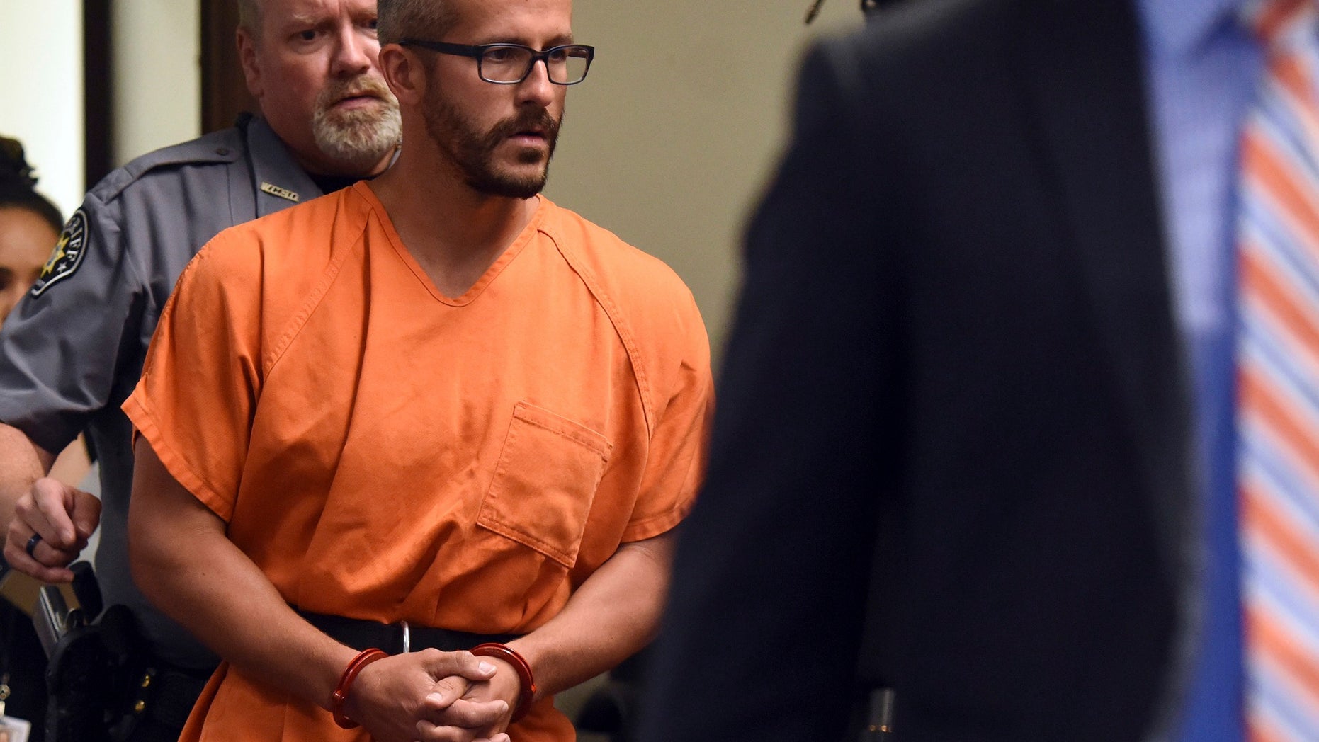 FILE - In this Aug. 16, 2018, file photo, Christopher Watts is escorted into the courtroom before his bond hearing at the Weld County Courthouse in Greeley, Colo. The Colorado man, charged with killing his pregnant wife and two daughters, has pleaded guilty Tuesday, Nov. 6, 2018, under a plea deal that will allow him to avoid the death penalty. (Joshua Polson/The Greeley Tribune via AP, Pool, file)