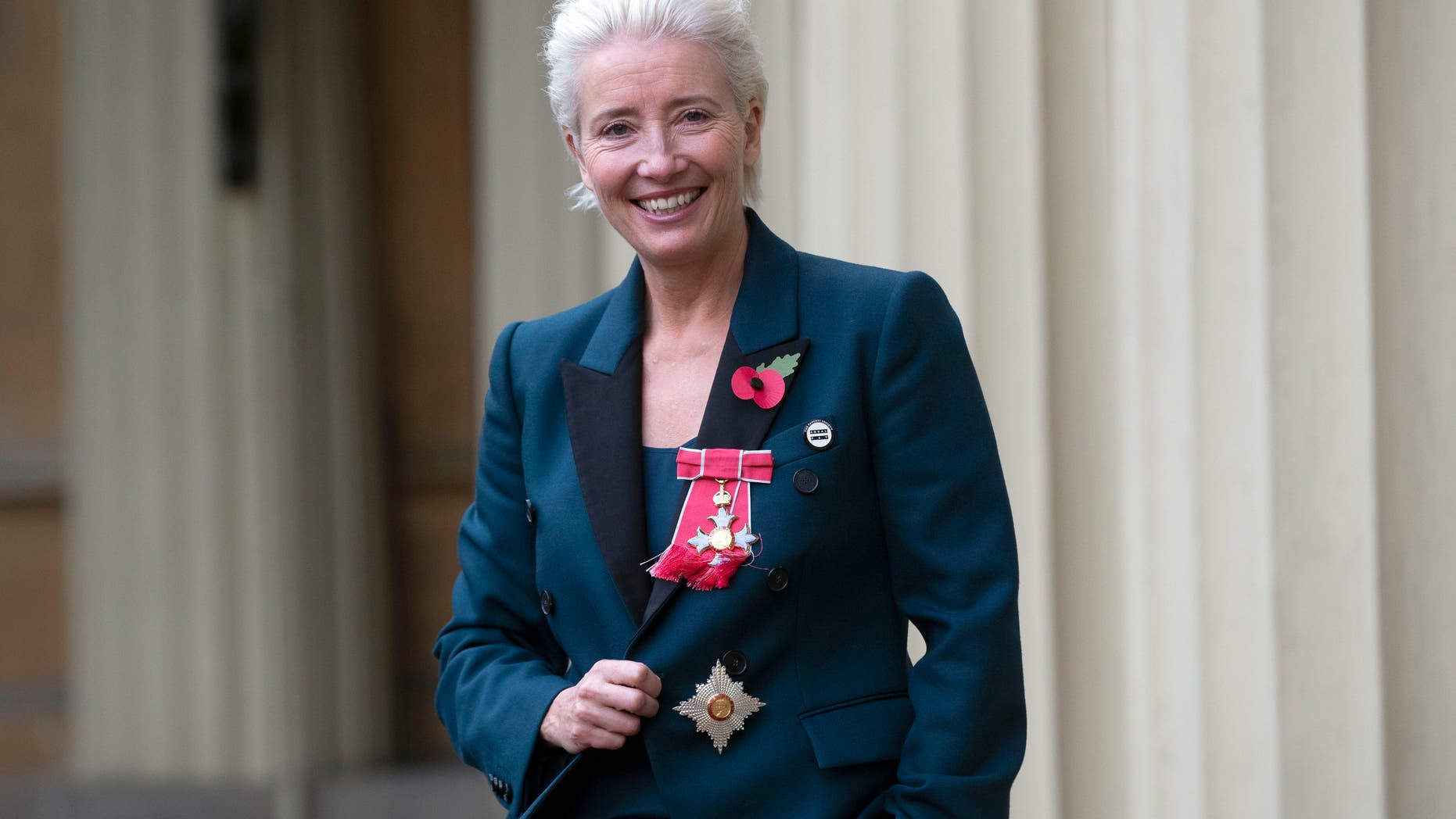 Emma Thompson stands outside Buckingham Palace, London, after being made a Dame Commander of the British Empire by Prince William on Wednesday Nov. 7, 2018.