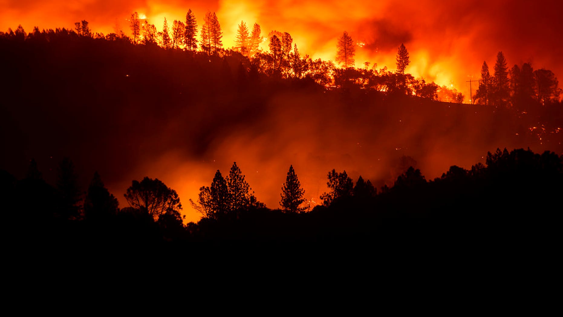 The Camp Fire burns along a ridgetop near Big Bend, Calif.