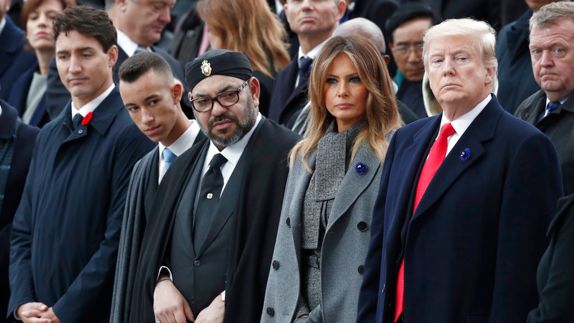 President Donald Trump, first lady Melania Trump, Morocco's King Mohammed VI, his son Crown Prince Moulay and Canadian Prime Minister Justin Trudeau, left, attend a commemoration ceremony for Armistice Day at the Arc de Triomphe in Paris. (AP)
