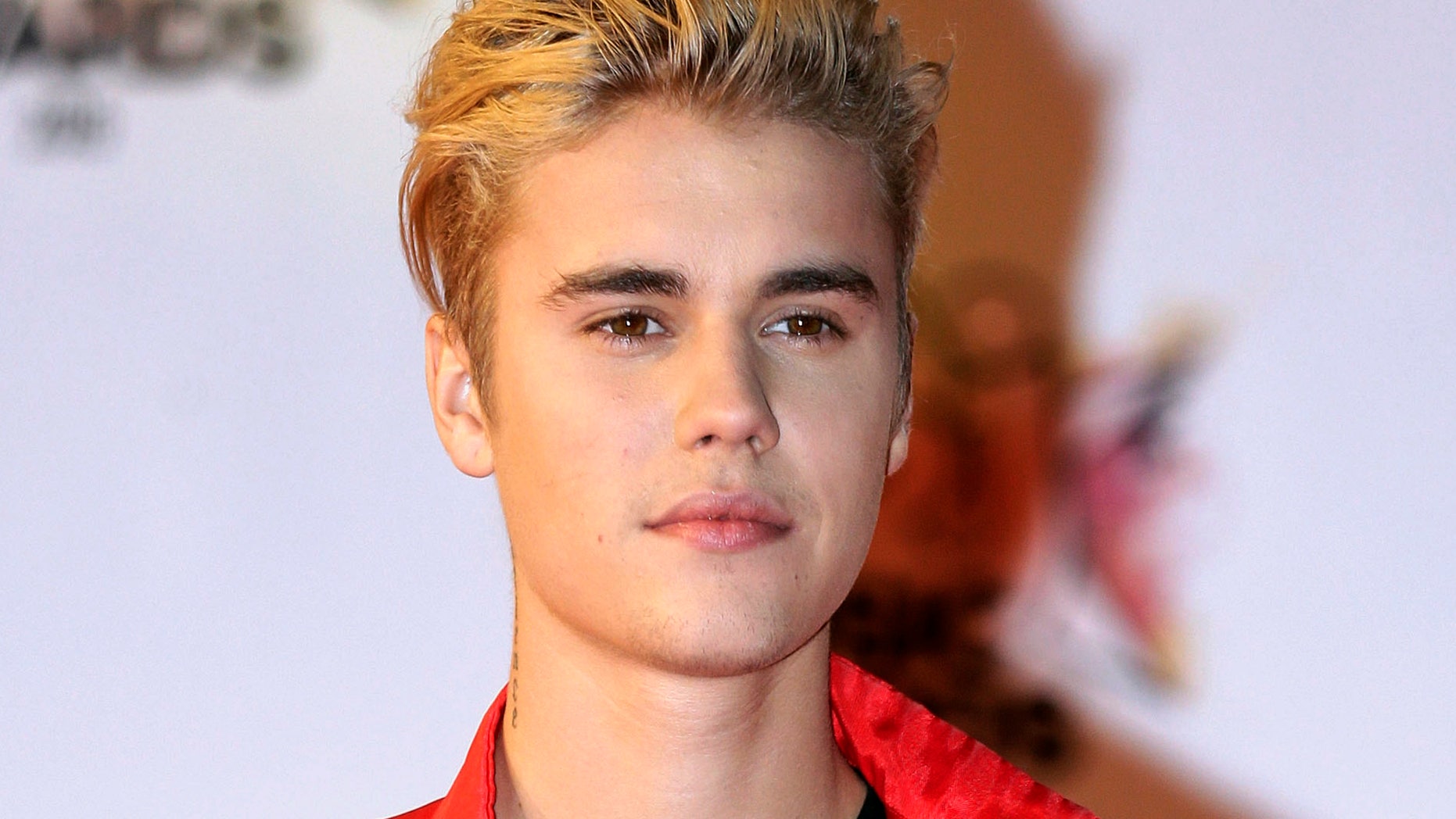 FILE - In this Nov. 7, 2015 file photo, Justin Bieber arrives at the Cannes festival palace in Cannes, southeastern France. Bieber and a former neighbor whose house he egged have agreed to a settlement in a long-running lawsuit.