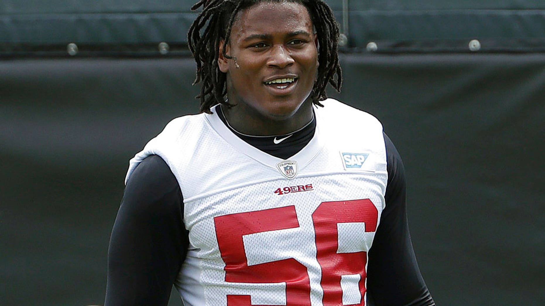 FILE - In this May 30, 2018, file photo, San Francisco 49ers linebacker Reuben Foster walks on the field during a practice at the team's NFL football training facility in Santa Clara, Calif. Foster was arrested Saturday, Nov. 24, at the team hotel on charges of domestic violence.