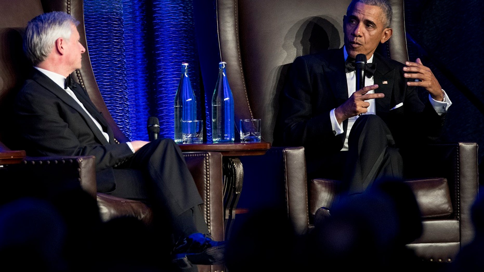 Former President Barack Obama talks with Jon Meacham during the celebration of the 25th Anniversary Gala of the Baker Institute for Public Policy at Rice University.