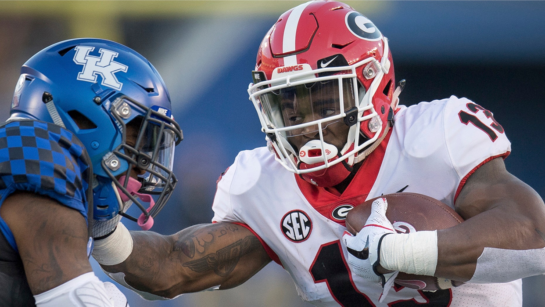 A woman fired a gun at her family because they wouldn't turn off the Georgia football game, police say.