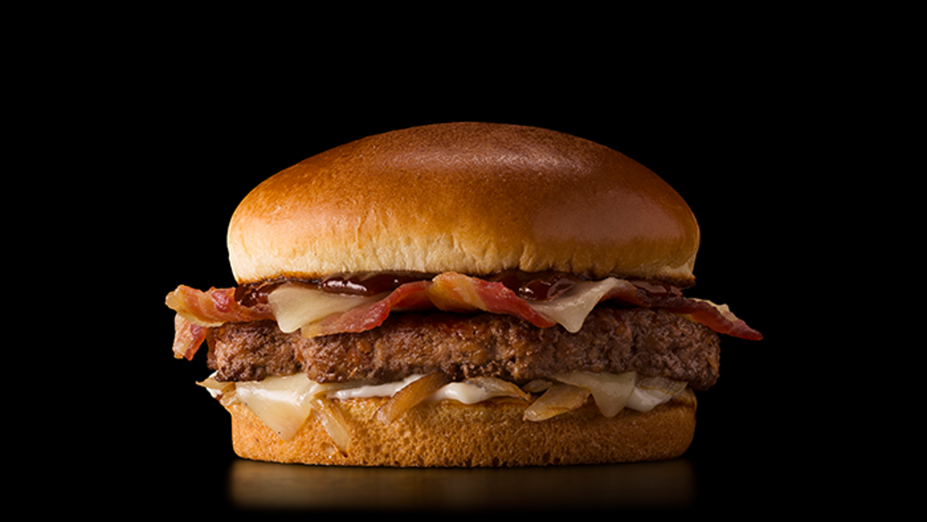 This McDonald’s is expanding its international menu again with menu items from India, Australia, France, Canada, and Germany - like this Cheddar BBQ Bacon Burger.