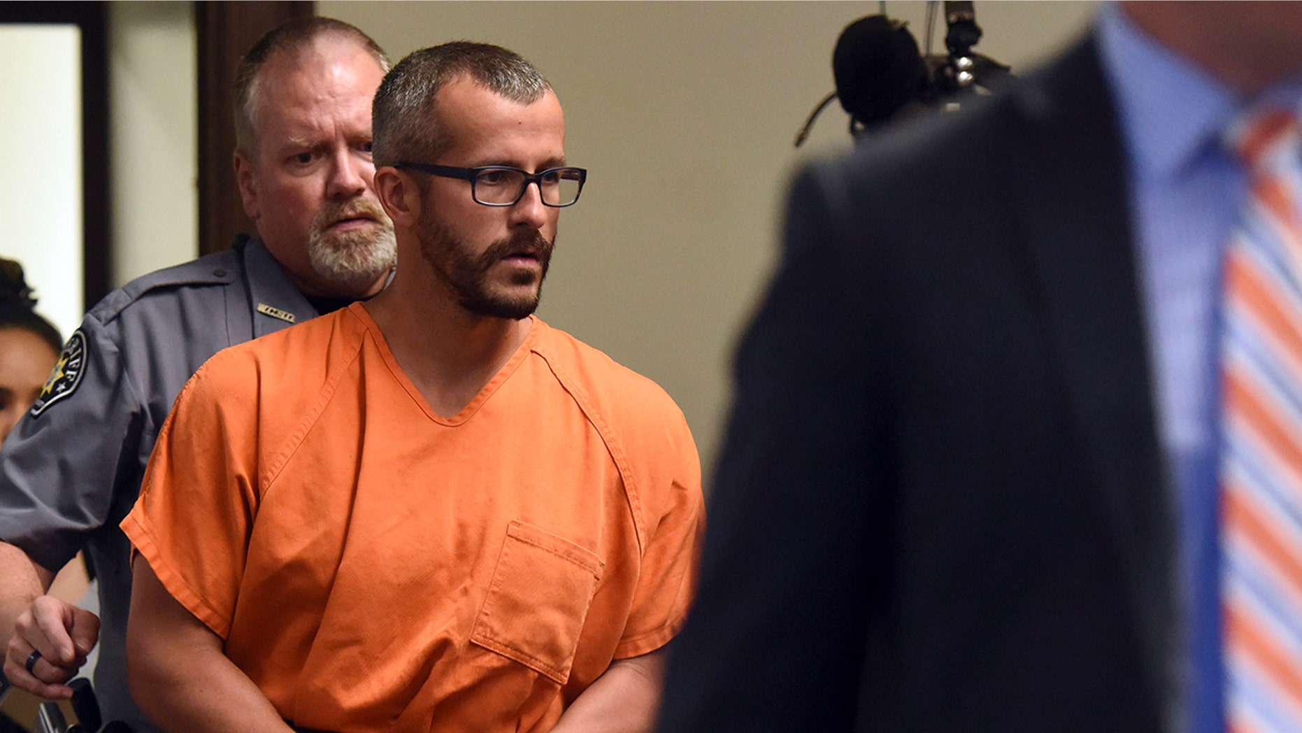 In this Aug. 16 file photo, Christopher Watts is escorted into the courtroom before his bond hearing at the Weld County Courthouse in Greeley, Colorado.