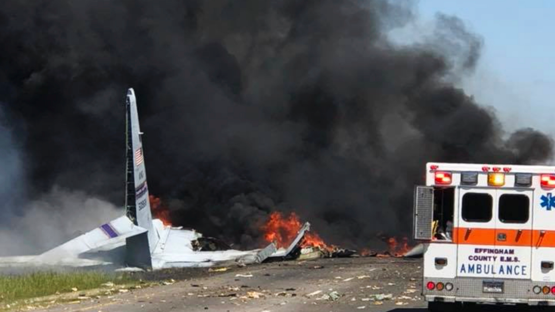 FILE - In this Wednesday, May 2, 2018 file photo, flames and smoke rise from an Air National Guard C-130 cargo plane after it crashed near Savannah, Ga. Investigators say the cause of the military plane crash that left nine people dead was pilot error. Nine airmen from the Puerto Rico National Guard died when the plane plunged onto Georgia Highway 21 shortly after takeoff from the Savannah airport. (James Lavine via AP, File)