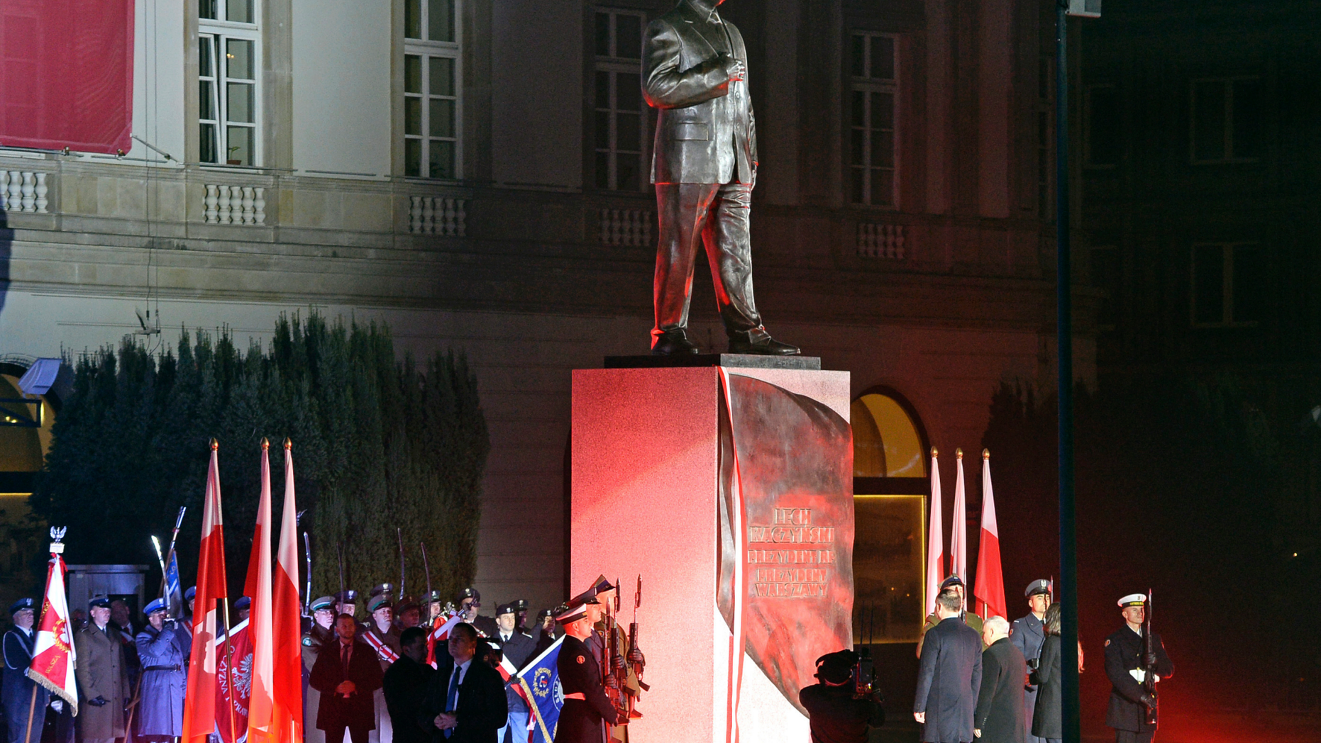 Polish President Andrzej Duda, left, and Jaroslaw Kaczynski, leader of Poland's ruling party Law and Justice and twin brother of Lech Kaczynski, stand in front of the monument of the late Polish President Lech Kaczynski, who died in a 2010 plane crash, in Warsaw, Poland, Saturday, Nov. 10, 2018. The official unveiling ceremony is taking part a day before the centennial observances marking 100 years of Polish independence. (AP Photo/Alik Keplicz)