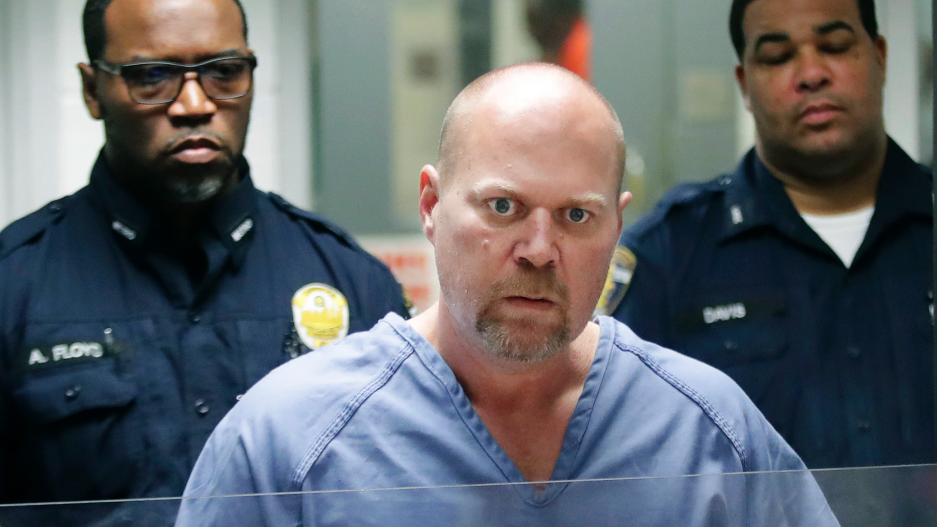 FILE - In this Oct. 25, 2018 file photo, Gregory Bush is arraigned on two counts of murder and 10 counts of wanton endangerment in Louisville, Ky. Bush, accused in the shooting deaths of two grocery store patrons in Kentucky has been indicted on two counts of murder. Prosecutors say Bush was indicted Wednesday, Oct. 31 by a Jefferson County grand jury in the shootings a week ago at a Kroger store in suburban Louisville. Bush also was indicted on one count of criminal attempted murder and two counts of first-degree wanton endangerment. Bush's case will proceed to Jefferson County Circuit Court in Louisville. (Scott Utterback /Courier Journal via AP, Pool)
