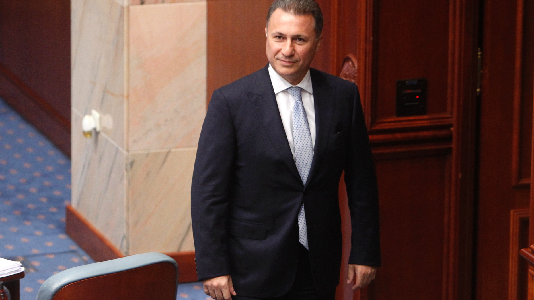 FILE - In this Oct. 19, 2018 file photo, Nikola Gruevski, Macedonia's former prime minister, looks on in parliament in the capital, Skopje. Macedonia’s Foreign Ministry said on Monday, Nov. 19, 2018, that it has summoned Hungary’s ambassador to formally demand that the government in Budapest reject an asylum application by Gruevski, who is a fugitive after he fled from Macedonia to Hungary. (AP Photo/Boris Grdanoski, File)