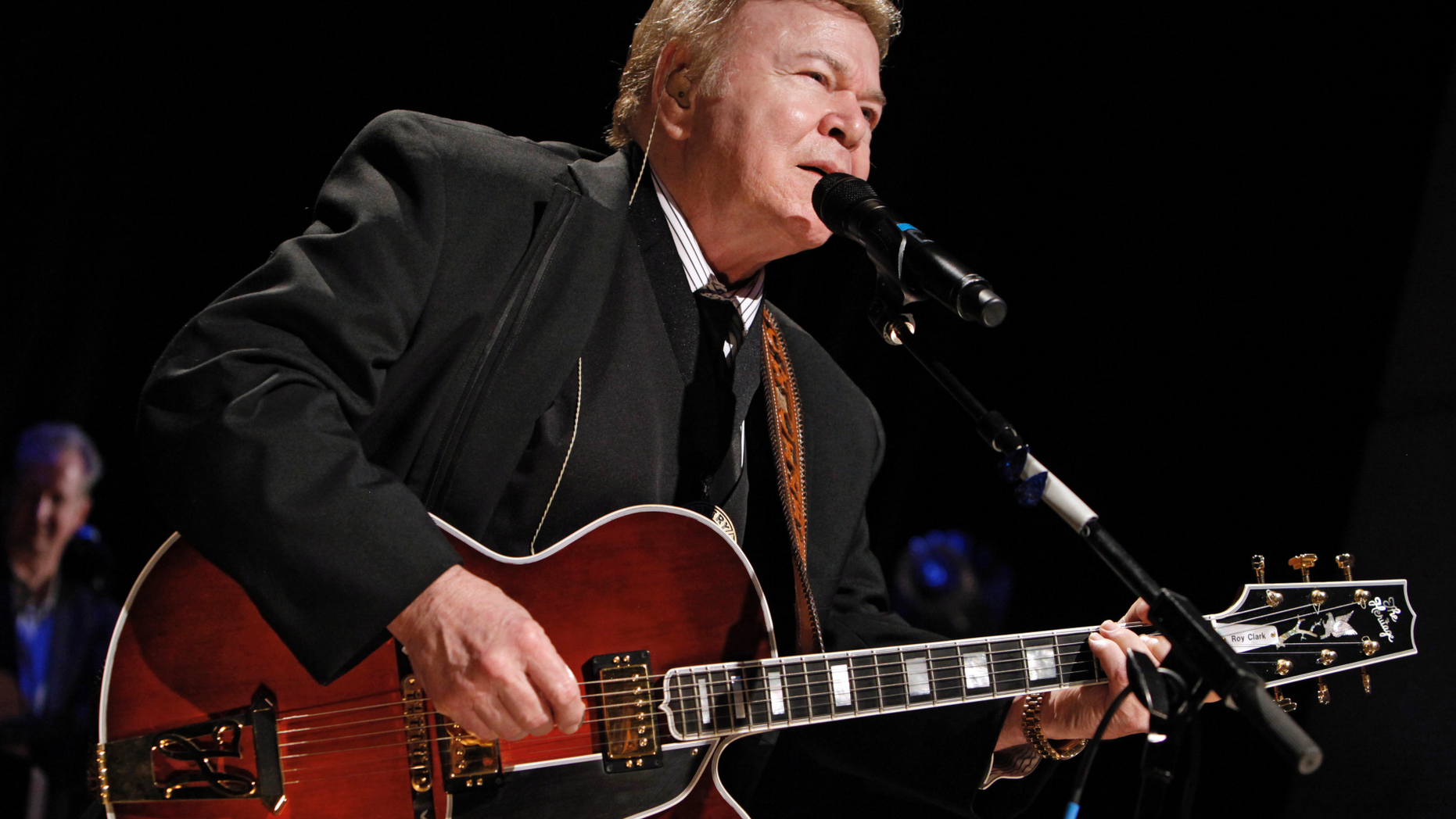 In this May 17, 2009, file photo, country music star Roy Clark performs after being inducted into the Country Music Hall of Fame in Nashville, Tenn. Clark, the guitar virtuoso and singer who headlined the cornpone TV show "Hee Haw" for nearly a quarter century, died Thursday, Nov. 15, 2018, due to complications from pneumonia at home in Tulsa, Okla., publicist Jeremy Westby said. He was 85.