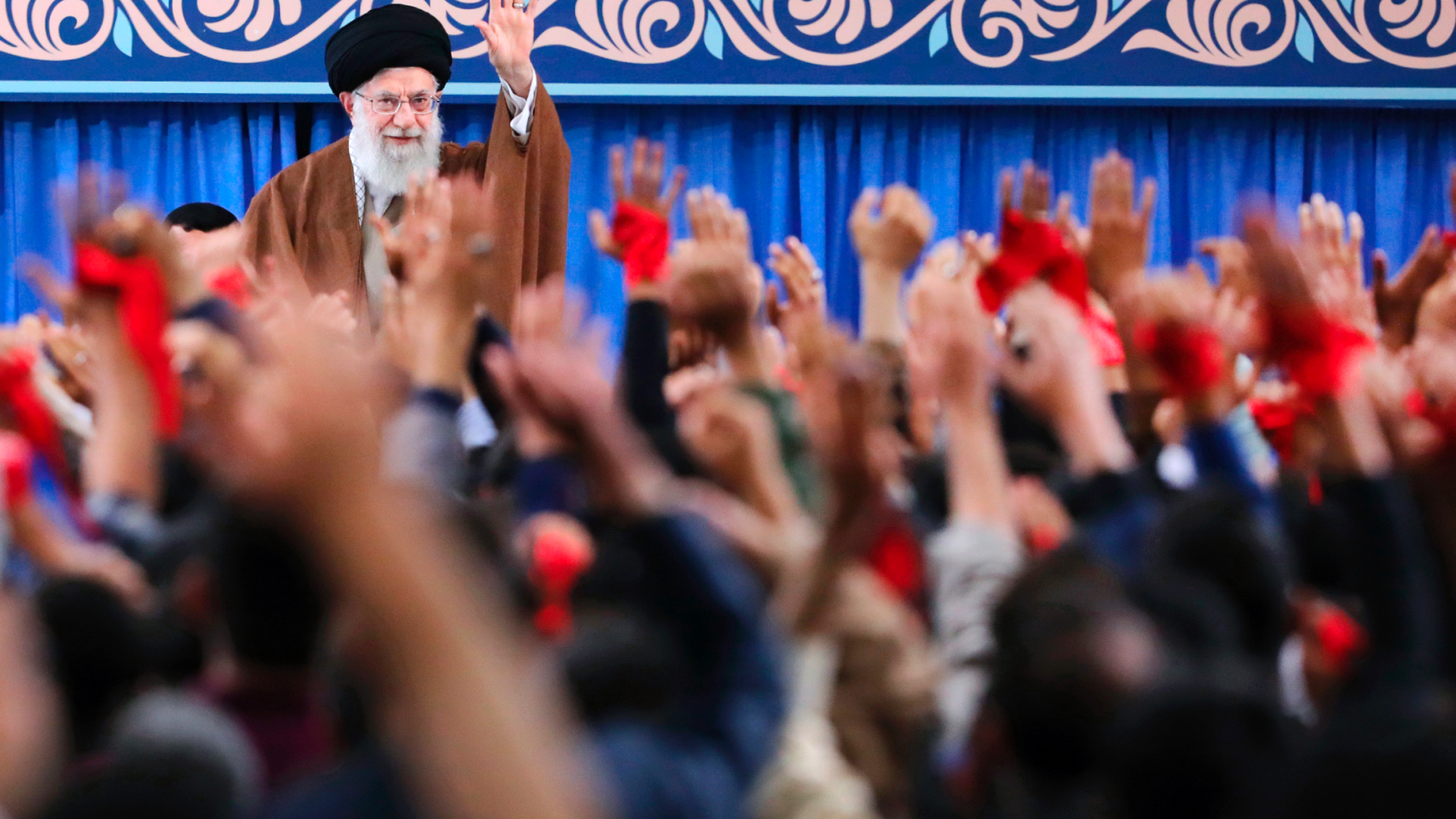 In this picture released by an official website of the office of the Iranian supreme leader, Supreme Leader Ayatollah Ali Khamenei waves to the crowd during a meeting in Tehran, Iran, Saturday, Nov. 3, 2018. Khamenei says on the eve of the anniversary of the 1979 takeover of the U.S. Embassy in Tehran that the Islamic Republic is the "victorious party" after nearly 40 years of confrontation by the U.S. (Office of the Iranian Supreme Leader via AP)