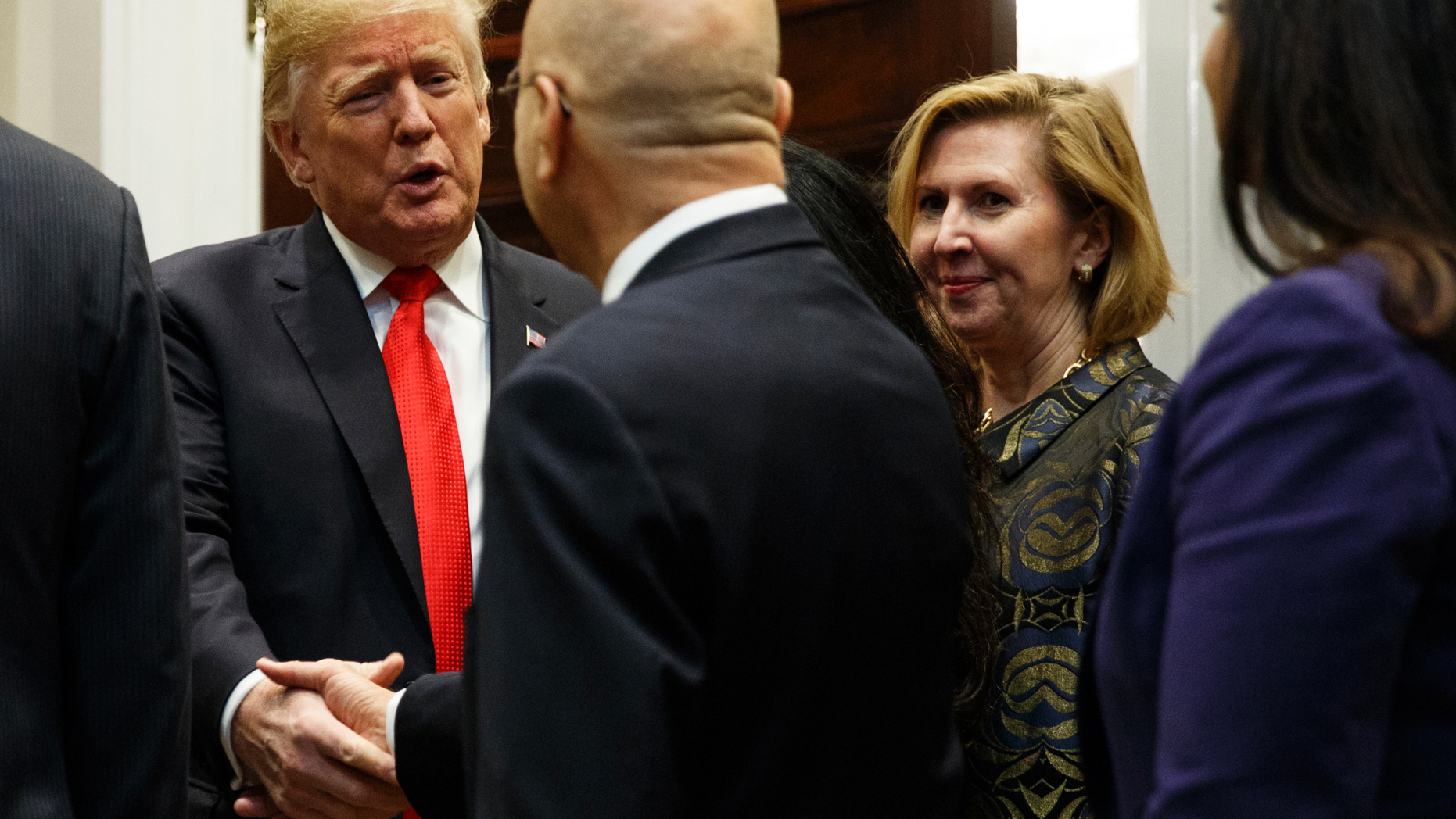Deputy National Security Adviser Mira Ricardel, right, watches as President Donald Trump arrives for a Diwali ceremonial lighting of the Diya in the Roosevelt Room of the White House, Tuesday, Nov. 13, 2018, in Washington. In an extraordinary move, first lady Melania Trump is publicly calling for the dismissal of Ricardel. After reports circulated that the president had decided to remove Ricardel, the first lady’s spokeswoman issued a statement saying: “It is the position of the Office of the First Lady that she no longer deserves the honor of serving in this White House.” Ricardel is national security adviser John Bolton’s deputy. (AP Photo/Evan Vucci)