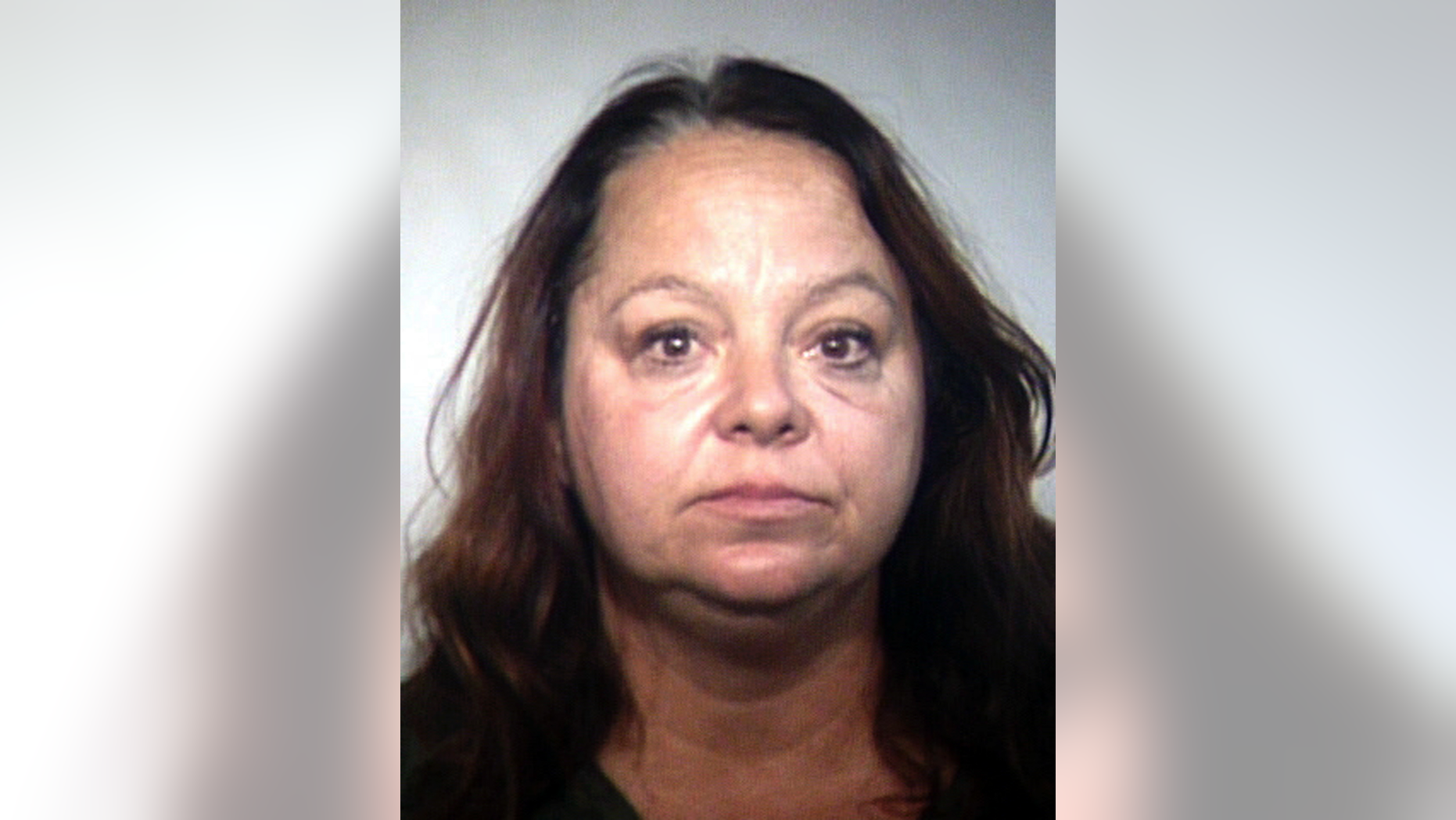 FILE - This March 15, 2018 file booking photo provided by the Tempe, Ariz., Police Department shows Elizabeth Dauenhauer, who was captured on video making derogatory comments about Muslims as she took pamphlets from an Arizona mosque. Dauenhauer, who tore down fliers from bulletin boards and removed fliers from bins in a courtyard behind the mosque in Tempe, is scheduled to be sentenced Thursday, Nov. 8 for her criminal damage conviction. (Tempe Police Department via AP, File)
