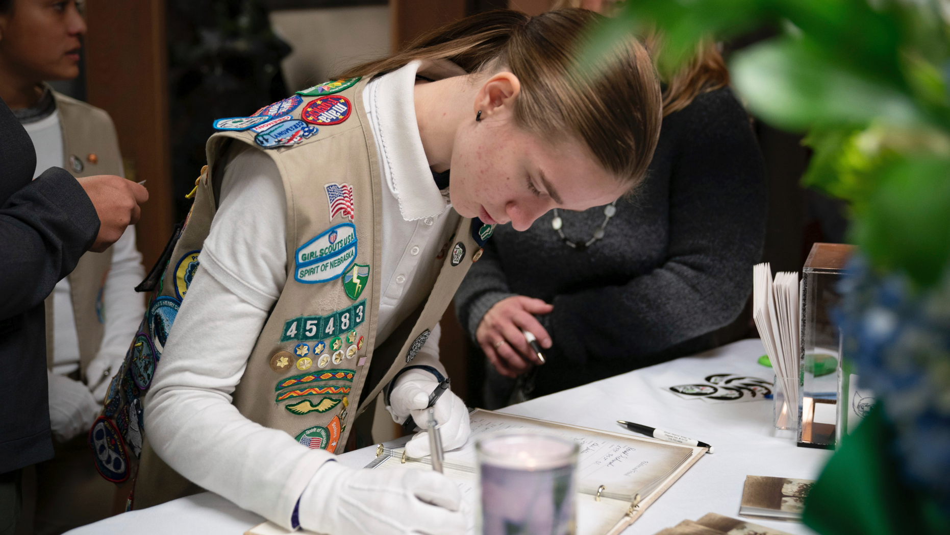 Caitlyn Talkington was part of the Spirit of Nebraska Girl Scout Honor Guard. The community of Chippewa Falls gathers as one Thursday, Nov. 8,2018, to mourn and remember three Girl Scouts and a mother who were run over and killed last weekend while picking up litter on a two-lane highway outside of town. Funerals for Sara Jo Schneider and her daughter Haylee Hickle were held on Thursday. (Glen Stubbe/Star Tribune via AP)