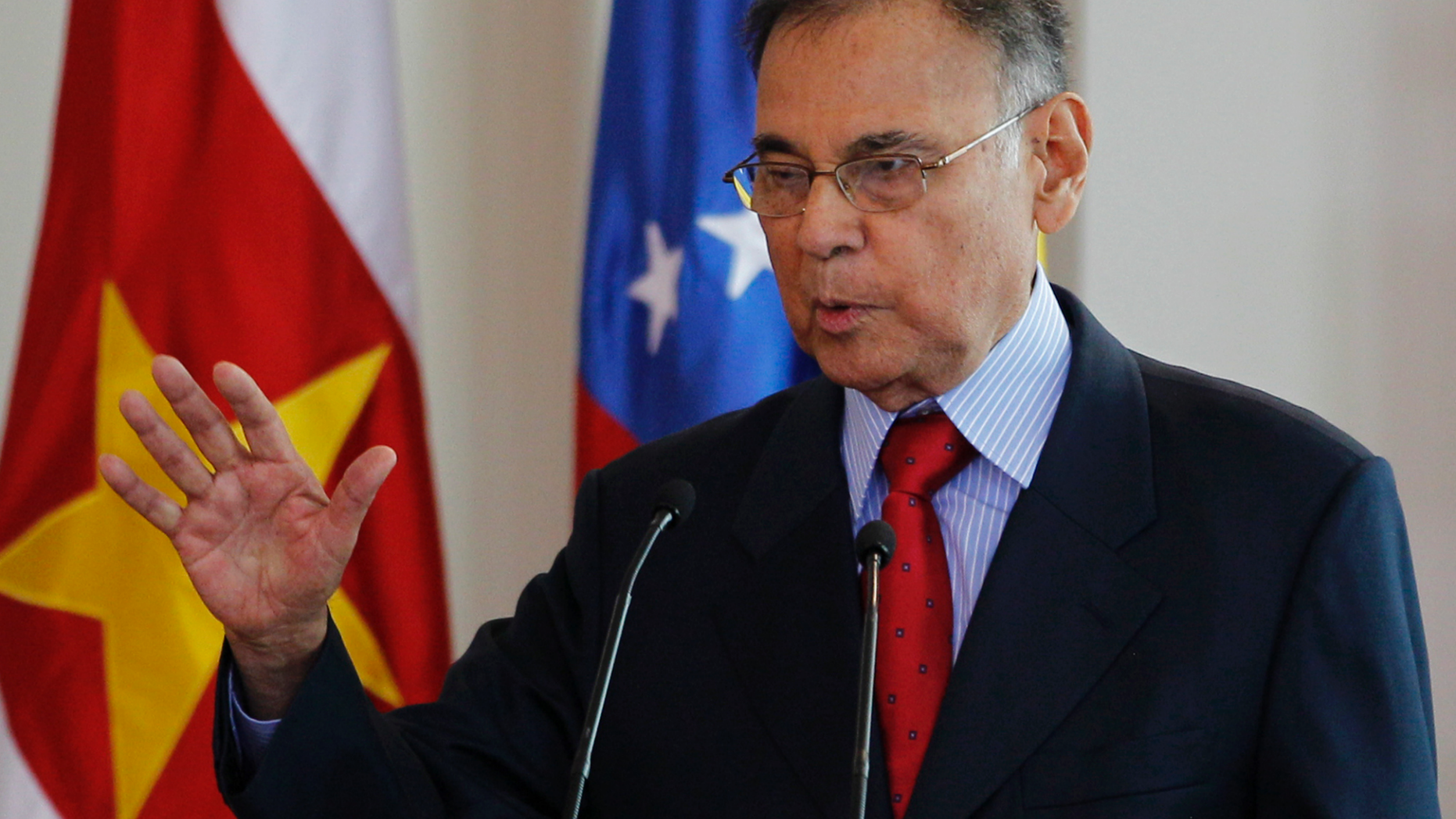 FILE - In this June 11, 2012 file photo, Venezuela's former Foreign Minister Ali Rodriguez delivers a speech as he takes office as secretary general of the Union of South American Nations, UNASUR at the Presidential Palace in Bogota, Colombia. Venezuelan state TV said Monday, Nov. 19, 2018, that Rodriguez passed away in Havana. (AP Photo/Fernando Vergara, File)