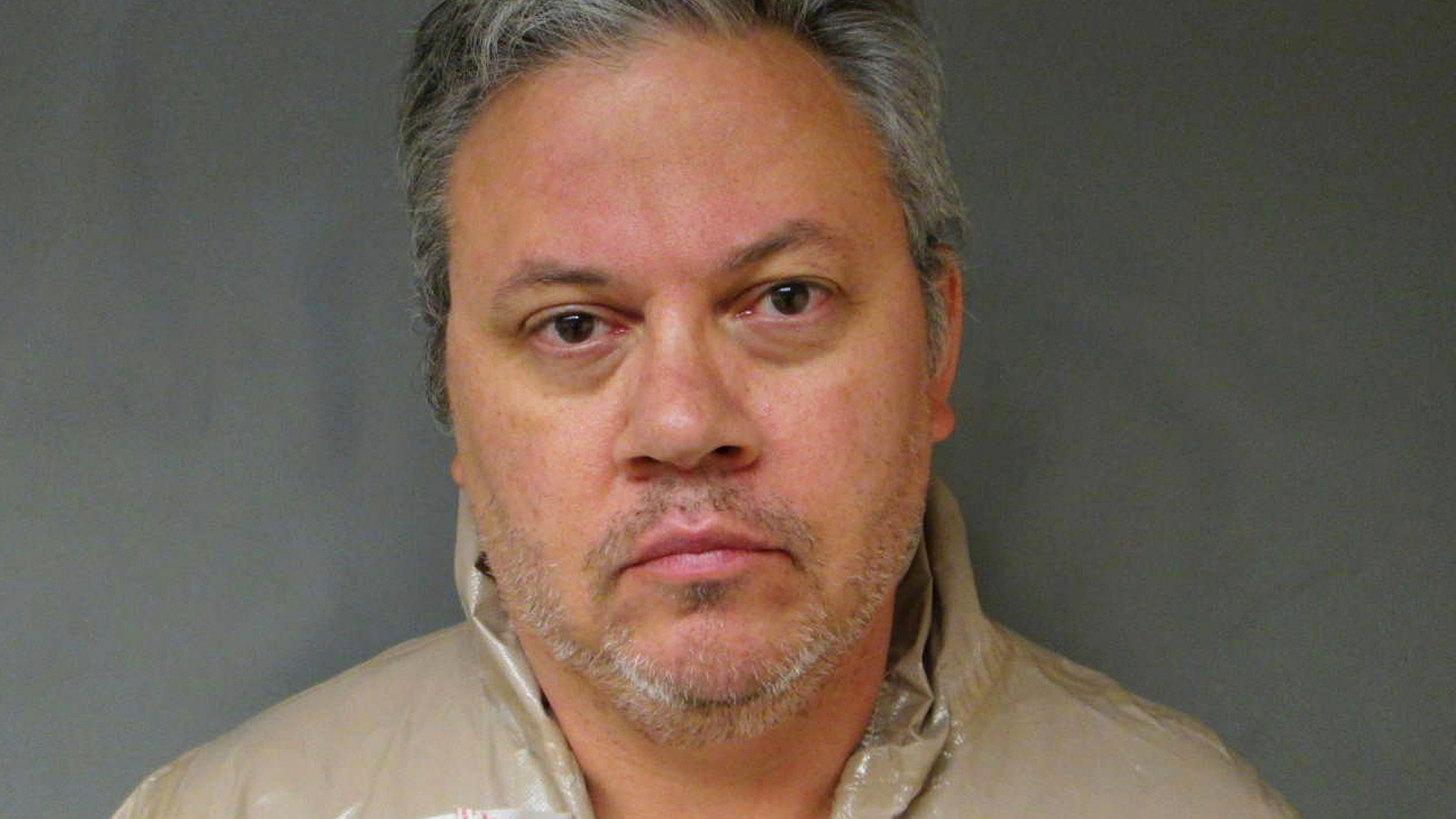 FILE - This Sept. 12, 2017, file booking photo provided by the Lebanon Police Department shows Travis Frink, of Warwick, R.I., charged with first-degree murder in the death of his 70-year-old mother, Pamela Ferriere, shot to death in the intensive care unit at Dartmouth-Hitchcock Medical Center in Lebanon, N.H. Frink is is due in Grafton County Superior Court on Tuesday, Nov. 20, 2018, for a plea hearing. (Lebanon Police Department via AP, File)