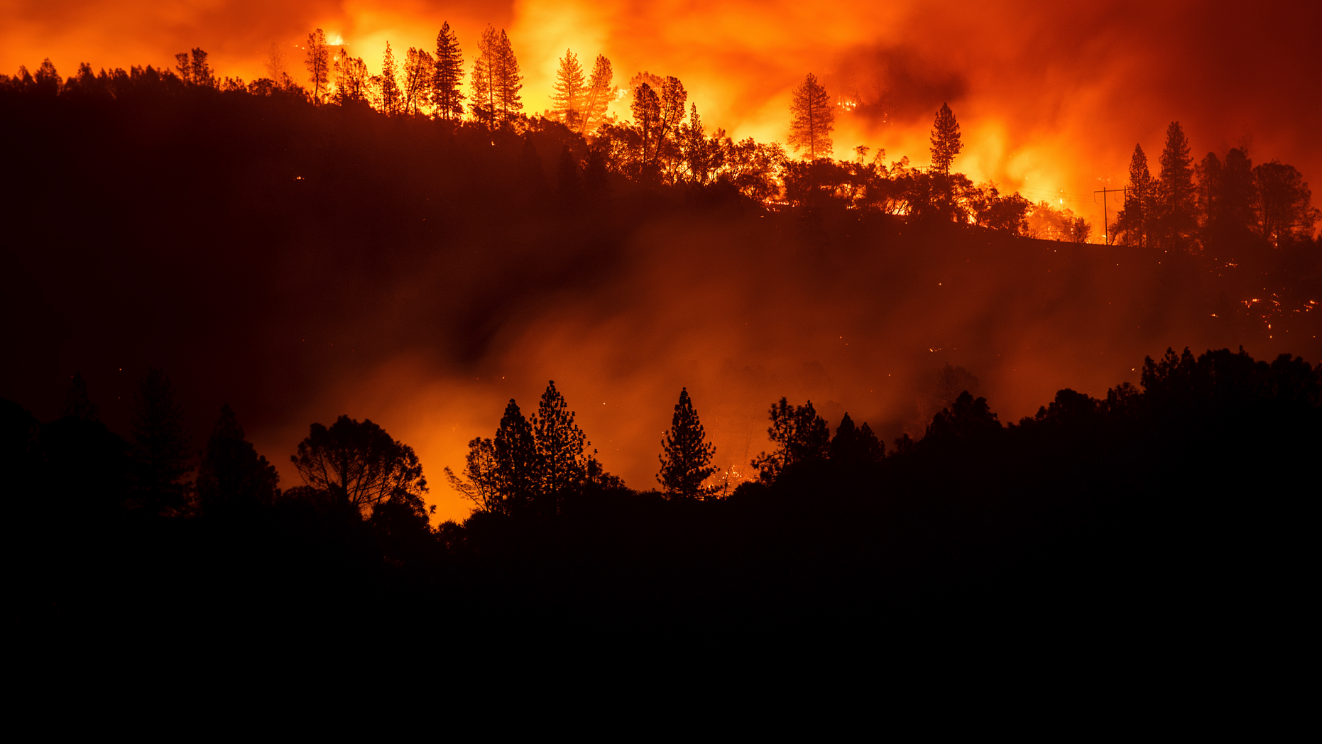 The Camp Fire burns along a ridgetop near Big Bend, Calif., on Saturday, Nov. 10, 2018. Crews working to contain the blaze overnight faced deteriorating weather conditions according to CalFire as winds picked up and humidity dropped. (AP Photo/Noah Berger)
