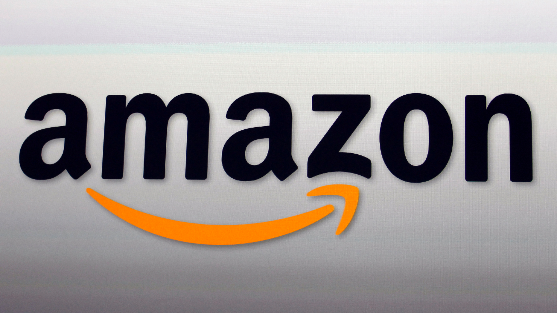 FILE - This Sept. 6, 2012, file photo, shows the Amazon logo in Santa Monica, Calif. (AP Photo/Reed Saxon, File)