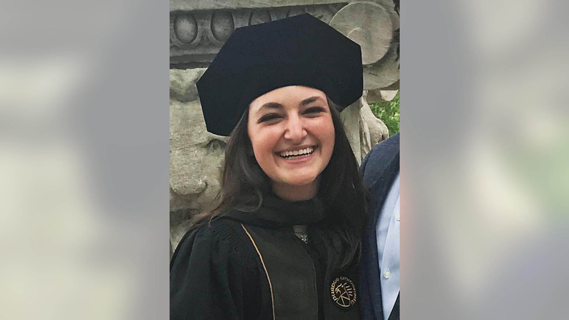 This May 2018 family photo provided by Brian Less shows his daughter Dayna Less at her graduation from Purdue University. Dayna was one of three people fatally shot by gunman, Juan Lopez, at Chicago's Mercy Hospital on Monday, Nov. 19. (Brian Less via AP)