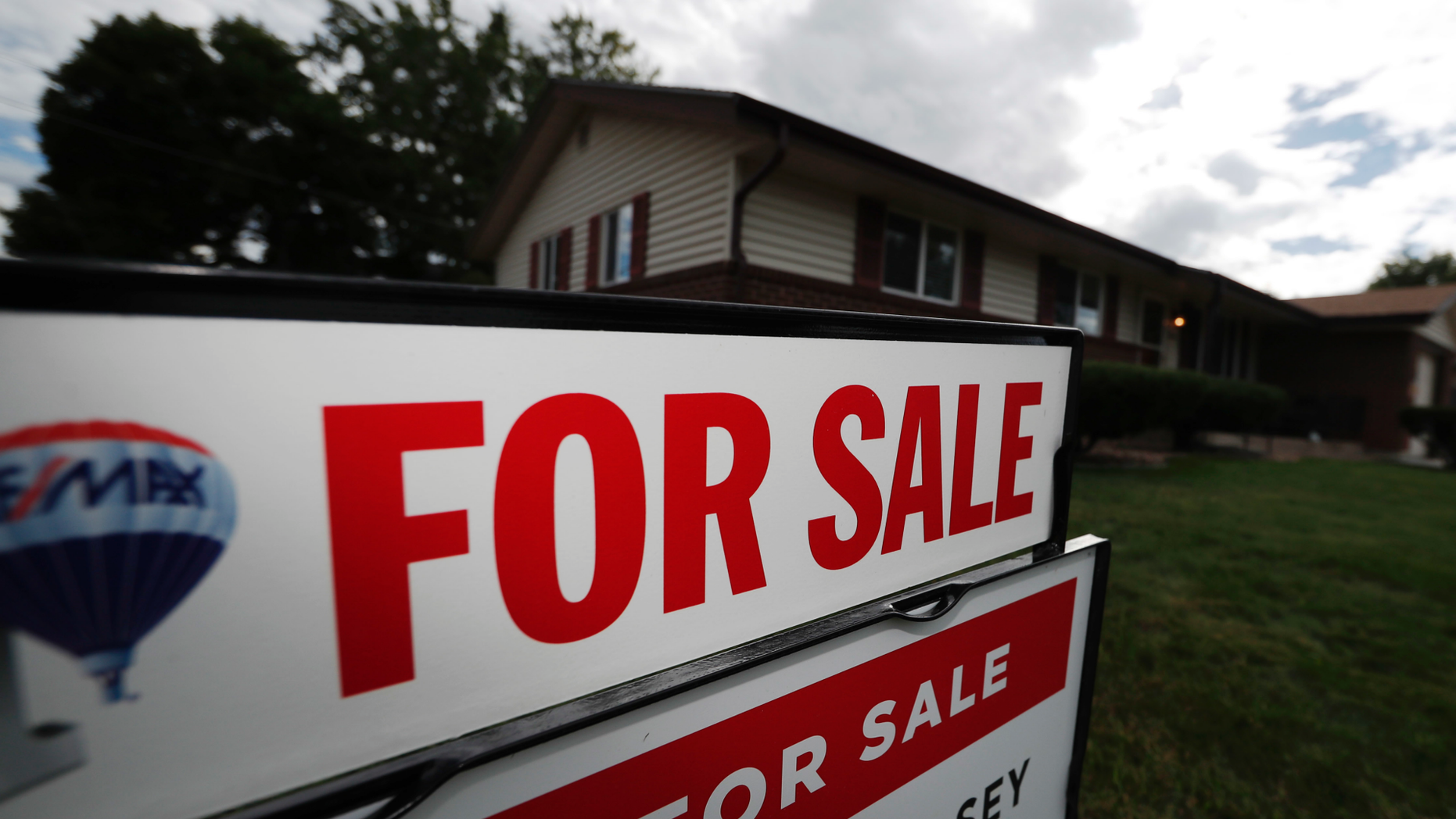 FILE- In this Oct 2, 2018, file photo, a for sale sign stands outside a home on the market in the north Denver suburb of Thornton, Colo. On Thursday, Nov. 15, Freddie Mac reports on this week's average U.S. mortgage rates. (AP Photo/David Zalubowski)
