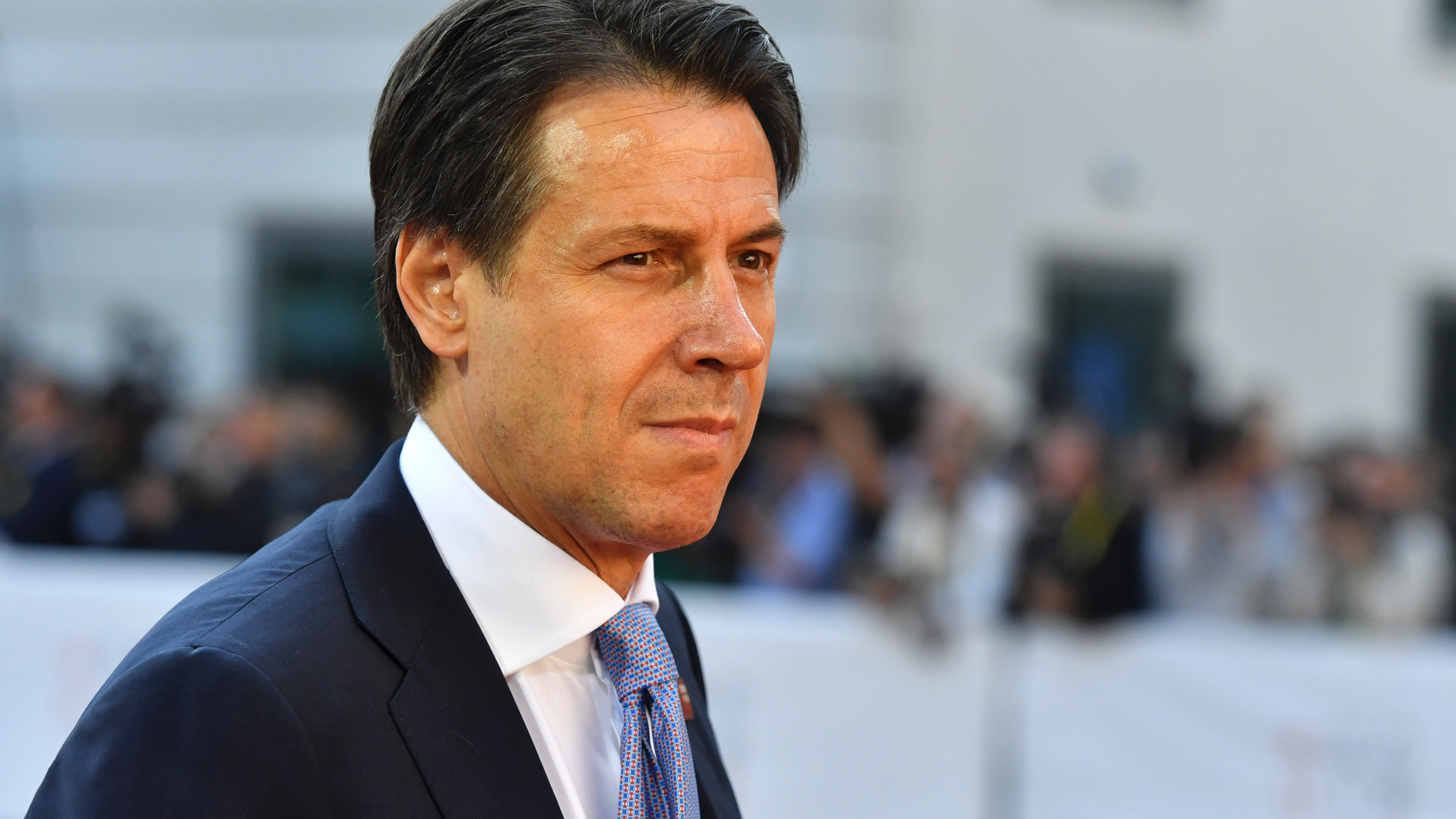 FILE - In this Thursday, Sept. 20, 2018 file photo, Italian Prime Minister Giuseppe Conte arrives at the informal EU summit in Salzburg, Austria. A gathering of leaders of Libya’s quarrelling factions and of countries keen on stabilizing the North African nation opens in Monday Nov. 12, 2018, where Italian Premier Giuseppe Conte will be greeting arrivals Monday evening in Sicily, aimed at finding a political settlement that would bolster the fight against Islamic militants and stop illegal migrants crossing the Mediterranean to Europe’s southern shores. (AP Photo/Kerstin Joensson, File)