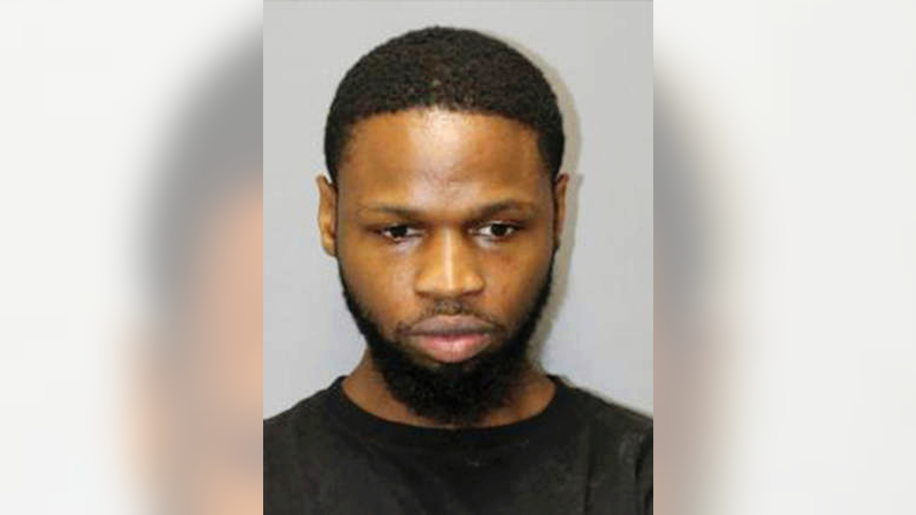 FILE - This undated file booking photo released by the Honolulu Police Department shows Isaiah McCoy. Sex trafficking charges in Hawaii have been dismissed against McCoy, a former death row inmate from Delaware. U.S. prosecutors dropped a 10-count indictment against Isaiah McCoy. A judge approved the dismissal Tuesday, Nov. 13, 2018, and McCoy walked out of court a free man. He tells The Associated Press he wants to relax and continue being an activist against wrongful convictions. (Honolulu Police Department via AP, File)
