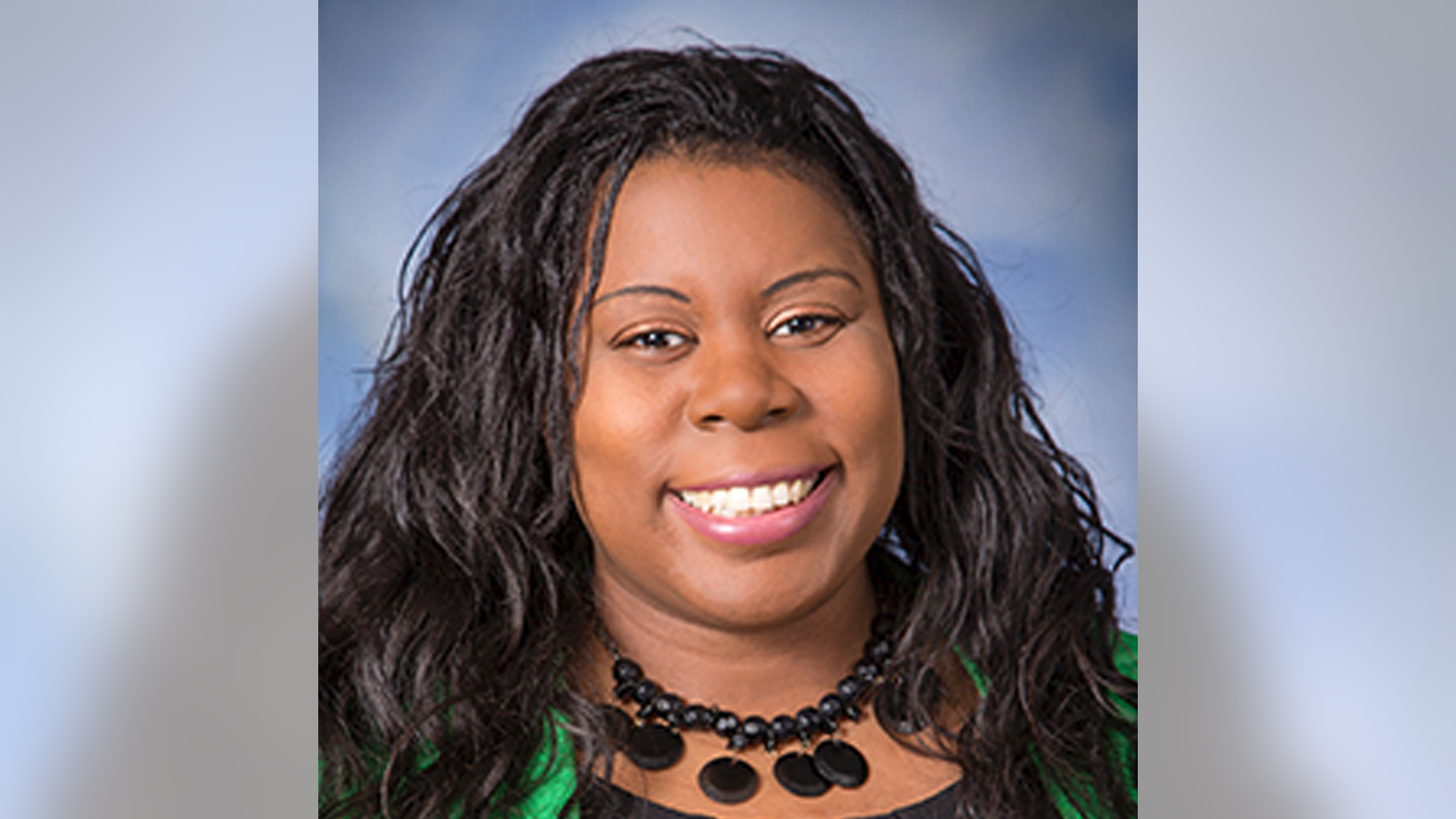 In this September 2017 photo provided by Monte Gerlach Photography Dr. Tamara O'Neal poses for a photo. O'Neal, an emergency room physician at Mercy Hospital in Chicago, was shot and killed by a gunman outside the hospital Monday, Nov. 19, 2018. (Monte Gerlach Photography via AP)