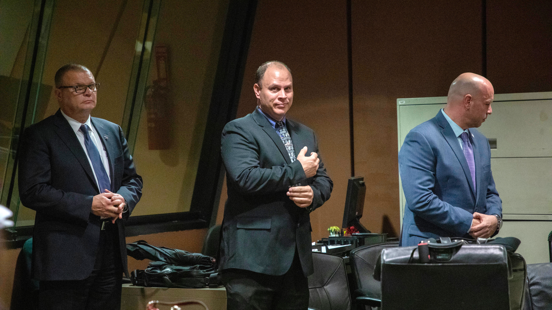 FILE - In this Oct. 30, 2018 file photo, from left, former Detective David March, Chicago Police Officer Thomas Gaffney and former officer Joseph Walsh appear at a pre-trial hearing at Leighton Criminal Court Building in Chicago. Prosecutors have laid out their case against the three Chicago police officers accused of participating in a cover-up of the fatal shooting of Laquan McDonald. The trial of officers charged with lying in their reports to protect Van Dyke is set to begin on Tuesday, Nov. 27, 2018. (Zbigniew Bzdak/Chicago Tribune via AP, Pool File)