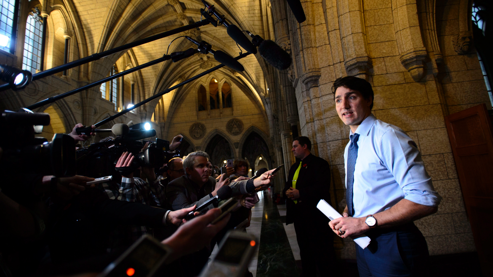 Prime Minister Justin Trudeau talks to reporters as he arrives to a caucus meeting on Parliament Hill in Ottawa, Ontario, on Wednesday, Nov. 7, 2018. (Sean Kilpatrick/The Canadian Press via AP)