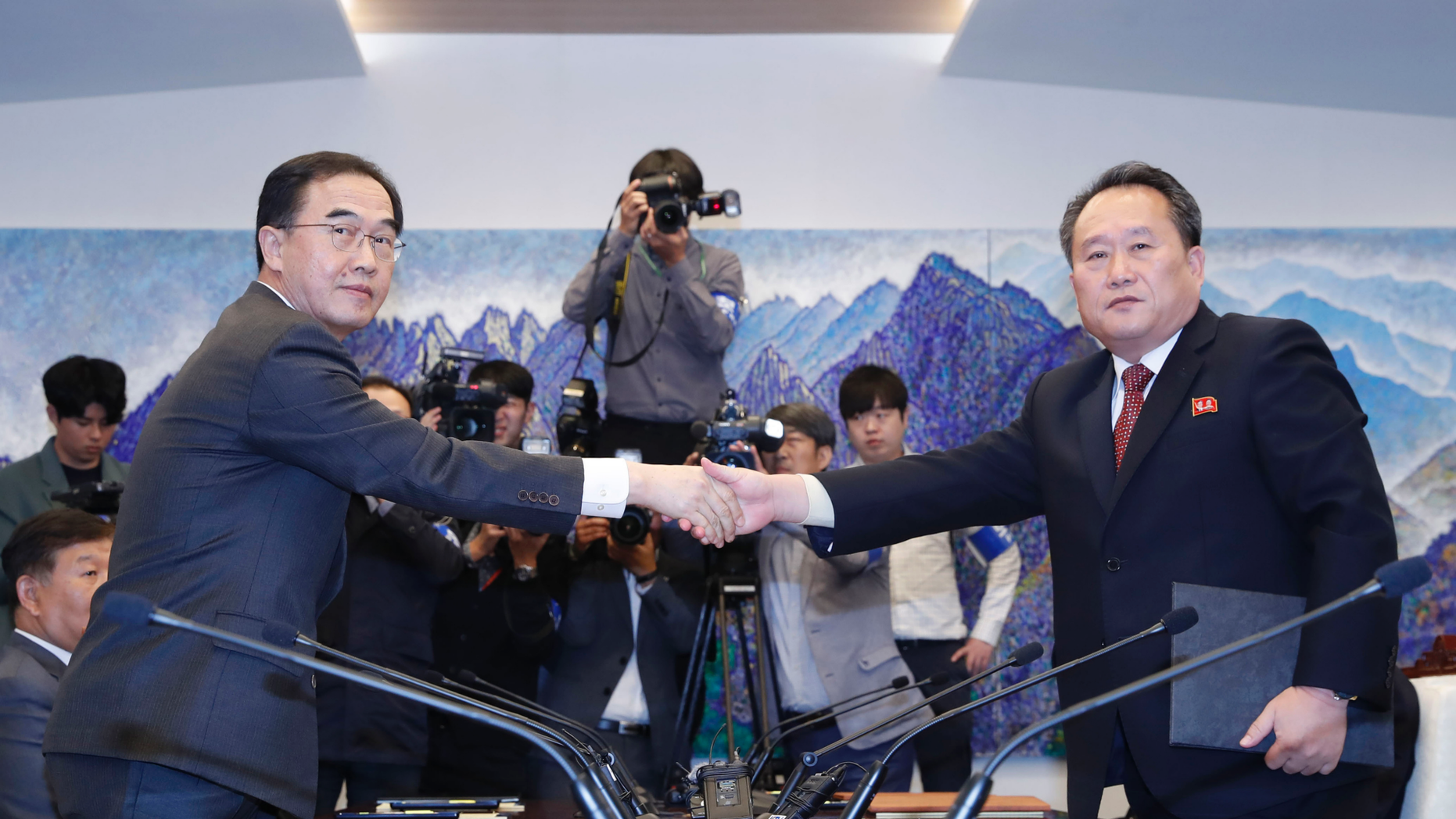 REPORT - In this photo of 15 October 2018, South Korean Unification Minister Cho Myoung-gyon, left, shakes hands with his North Korean counterpart, Ri Son Gwon, after exchanging the joint statement at their meeting south of Panmunjom in the Demilitarized Zone, South Korea. South Korea said the United Nations Security Council has granted a sanctions exemption for investigations into North Korean railway sections that the Koreas want to link to the South. (Korea Pool / Yonhap via AP, File)